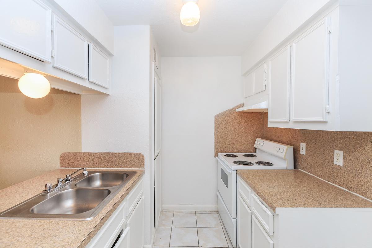 Kitchen with tan countertops