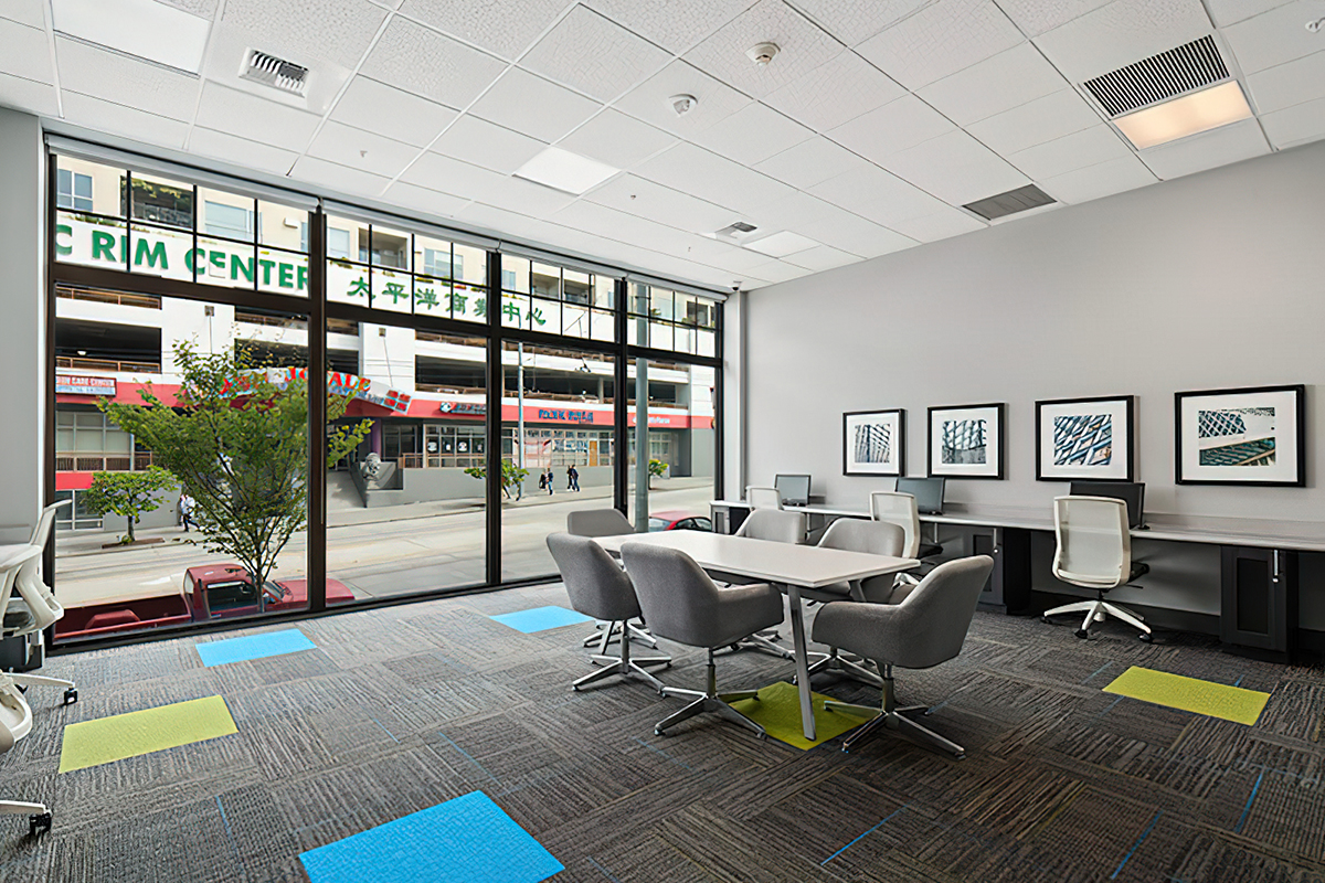 an office with a desk and chair in a room