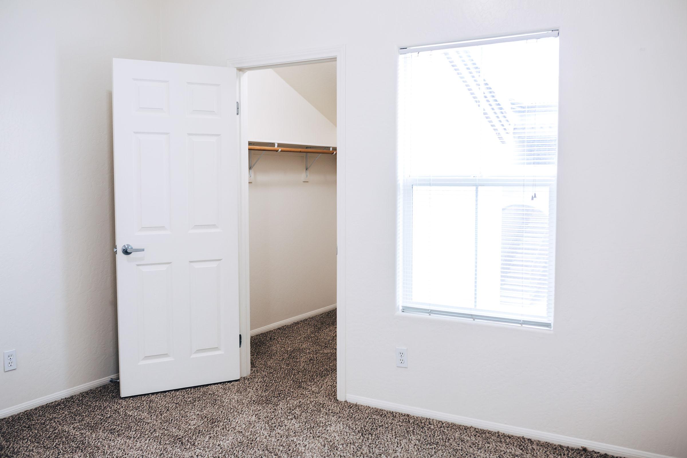 unfurnished bedroom with walk-in closet