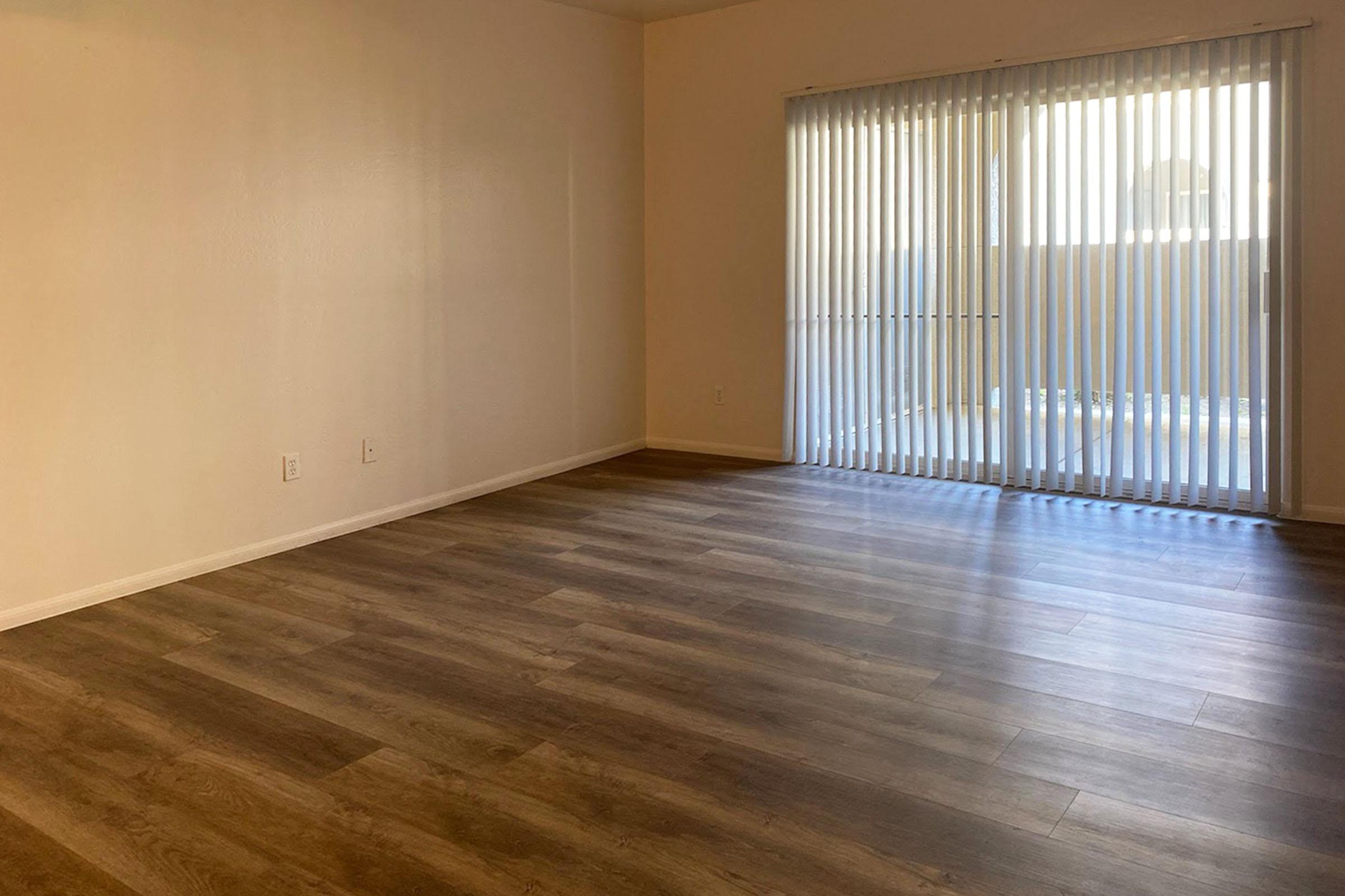 unfurnished living room with wooden floors