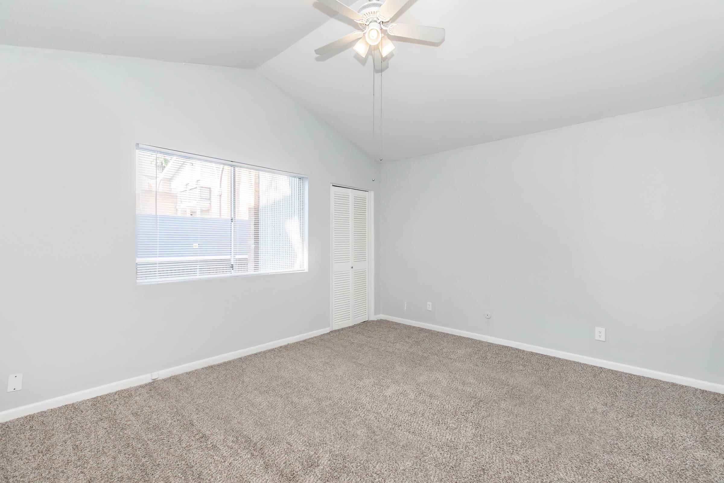 a bedroom with a large window