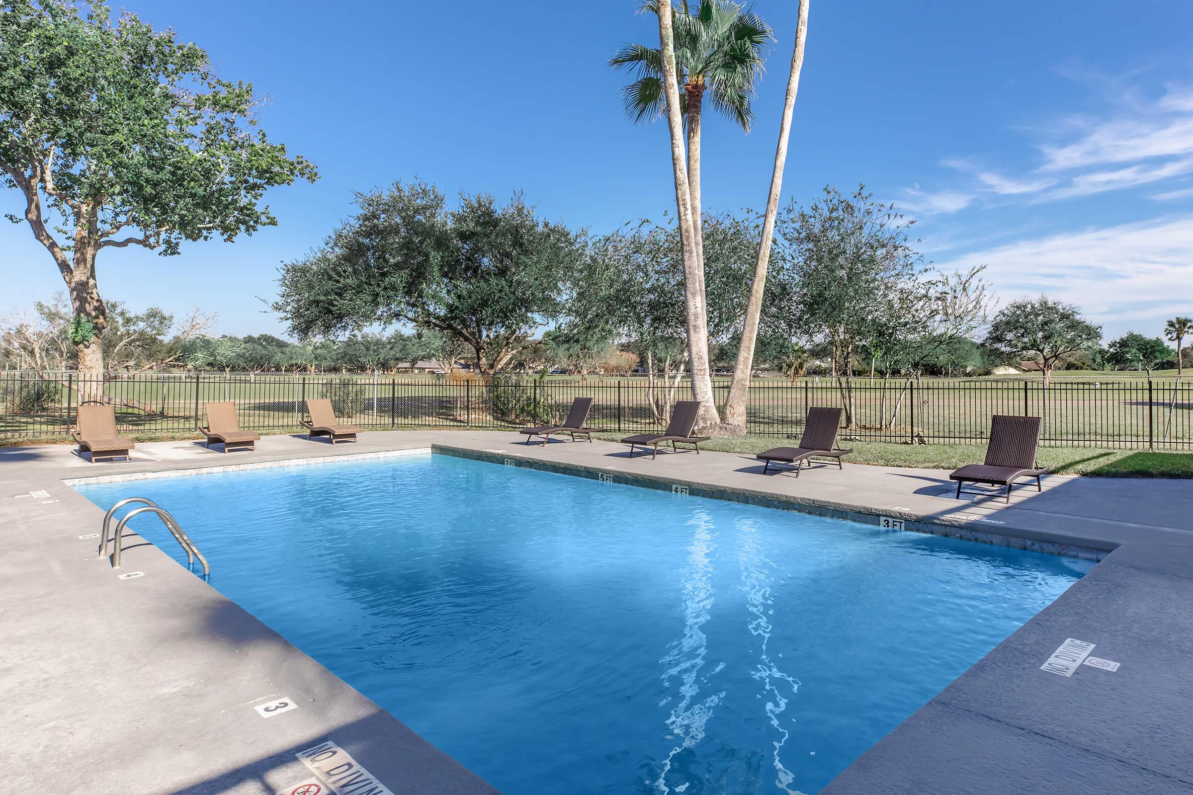 a pool next to a body of water