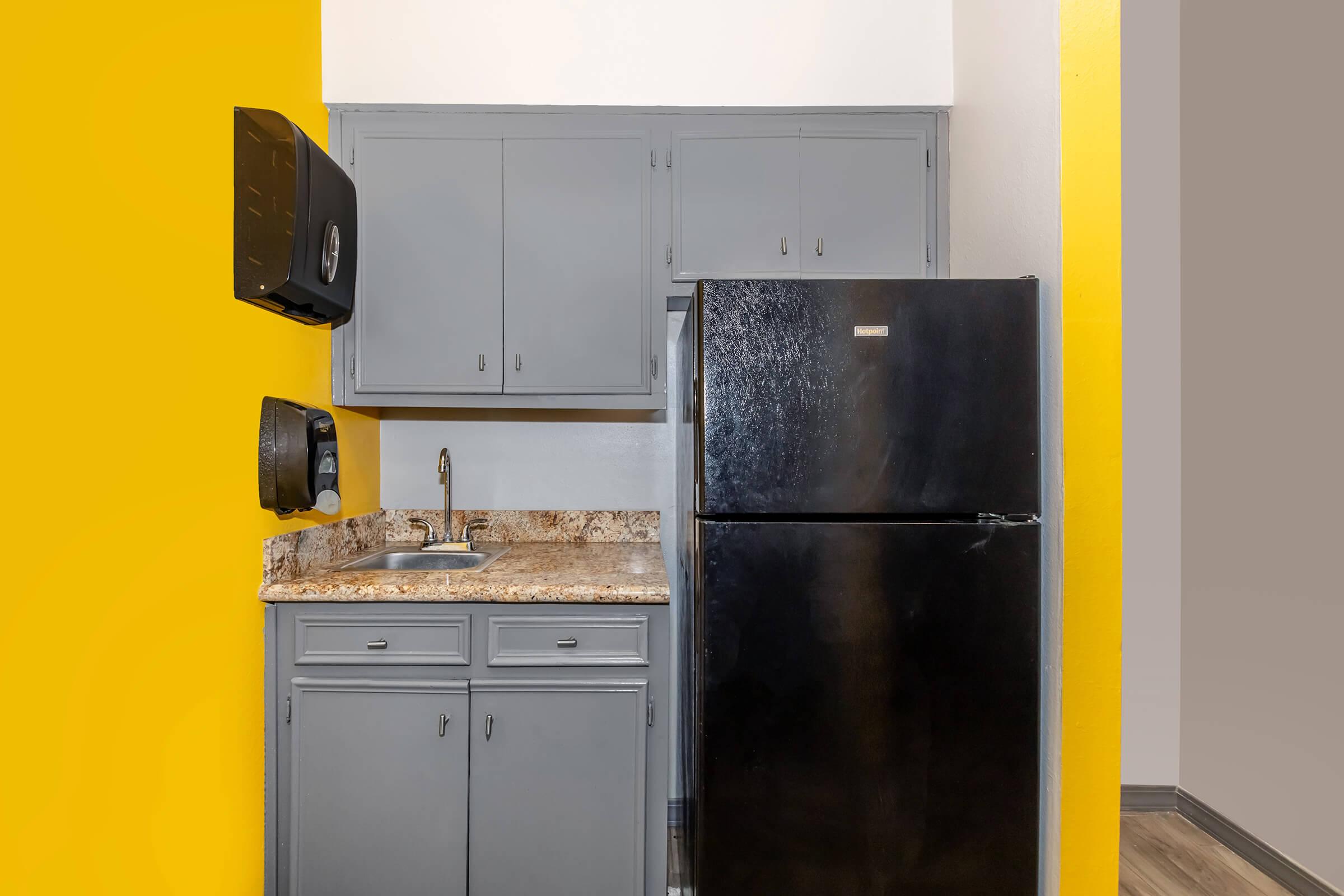 a kitchen with a stove top oven sitting inside of a refrigerator