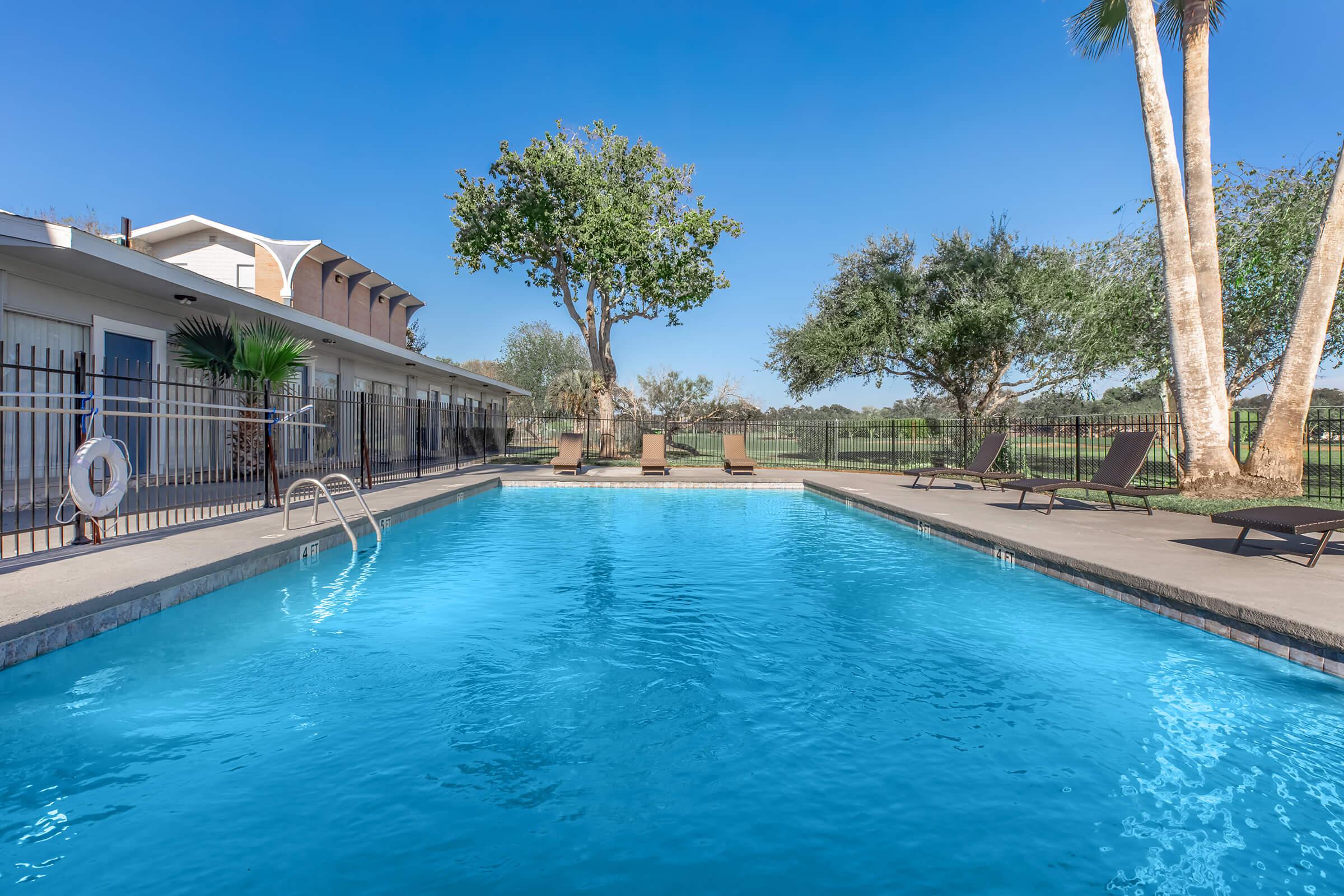 a pool next to a body of water