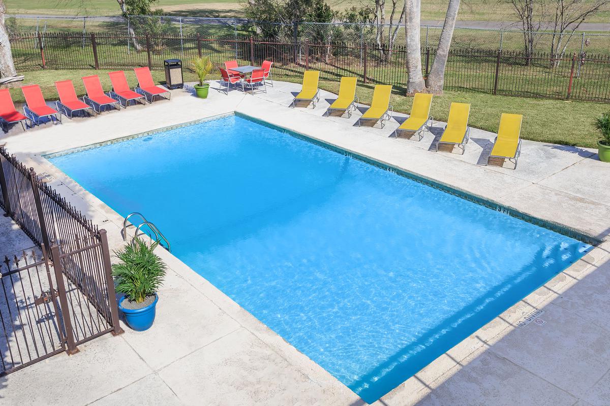 a pool next to a fence