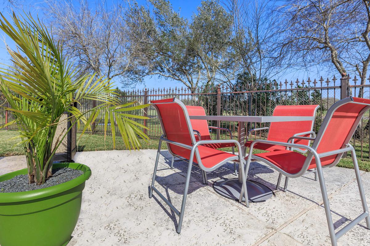 a couple of lawn chairs sitting on top of a red chair