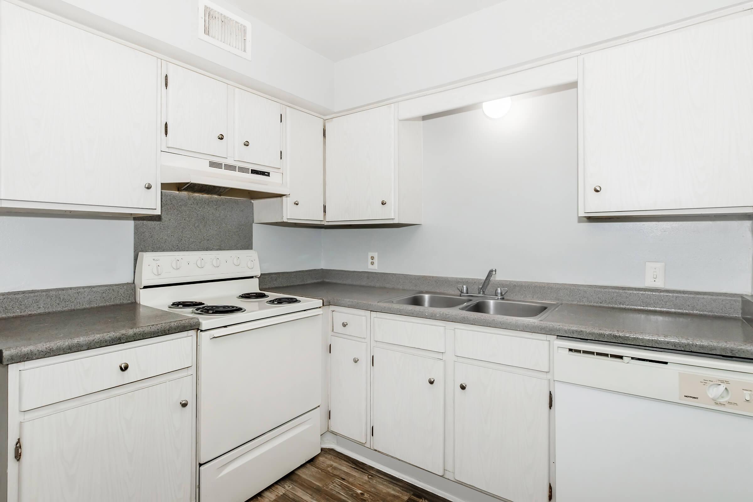 a kitchen with a stove and a refrigerator