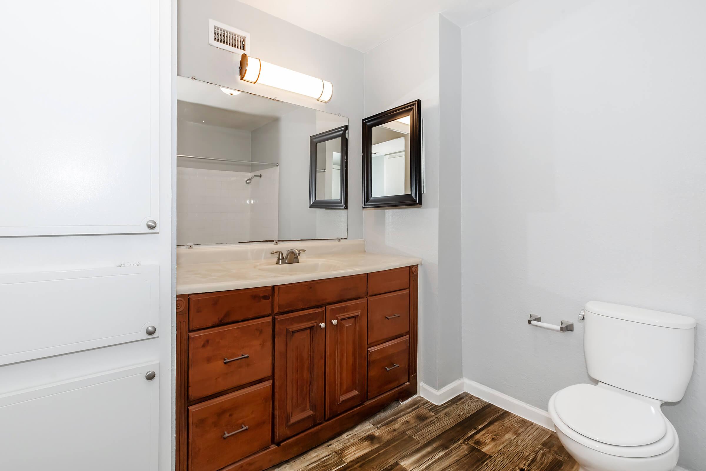 a kitchen with a sink and a mirror