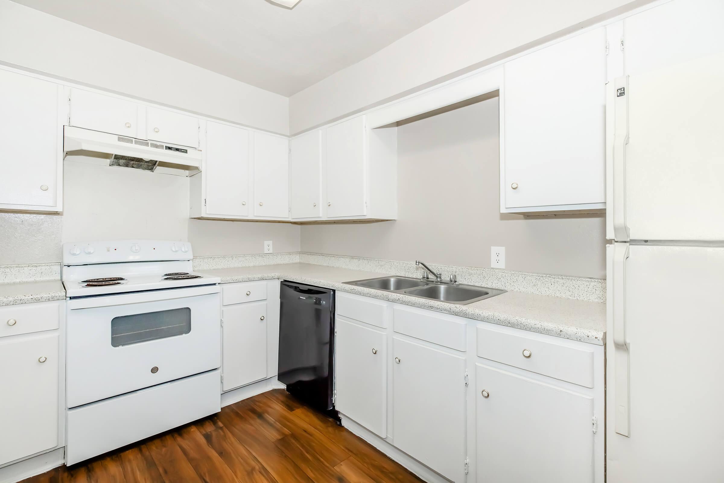 a kitchen with a stove and a refrigerator