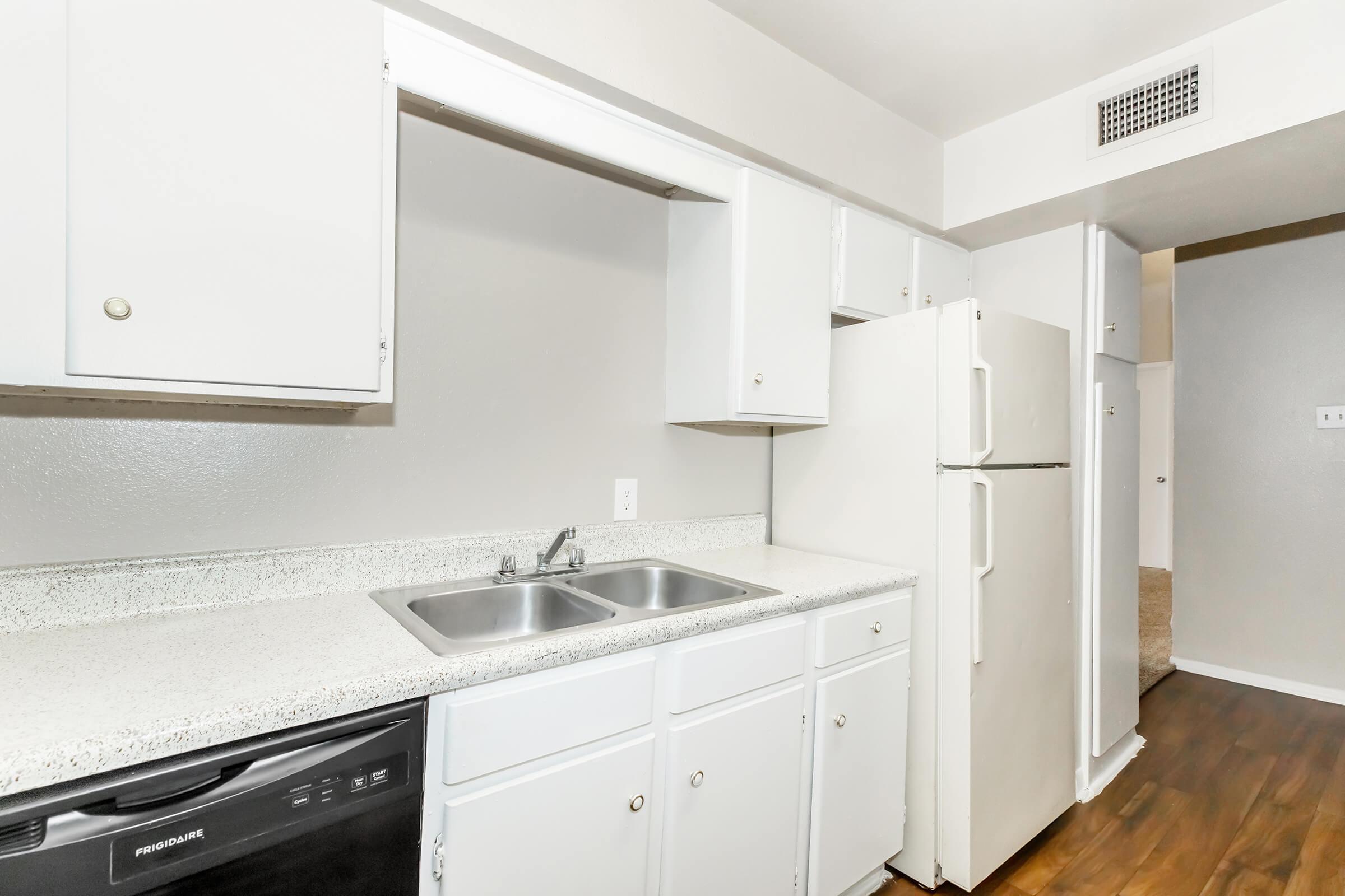 a kitchen with a stove and a sink