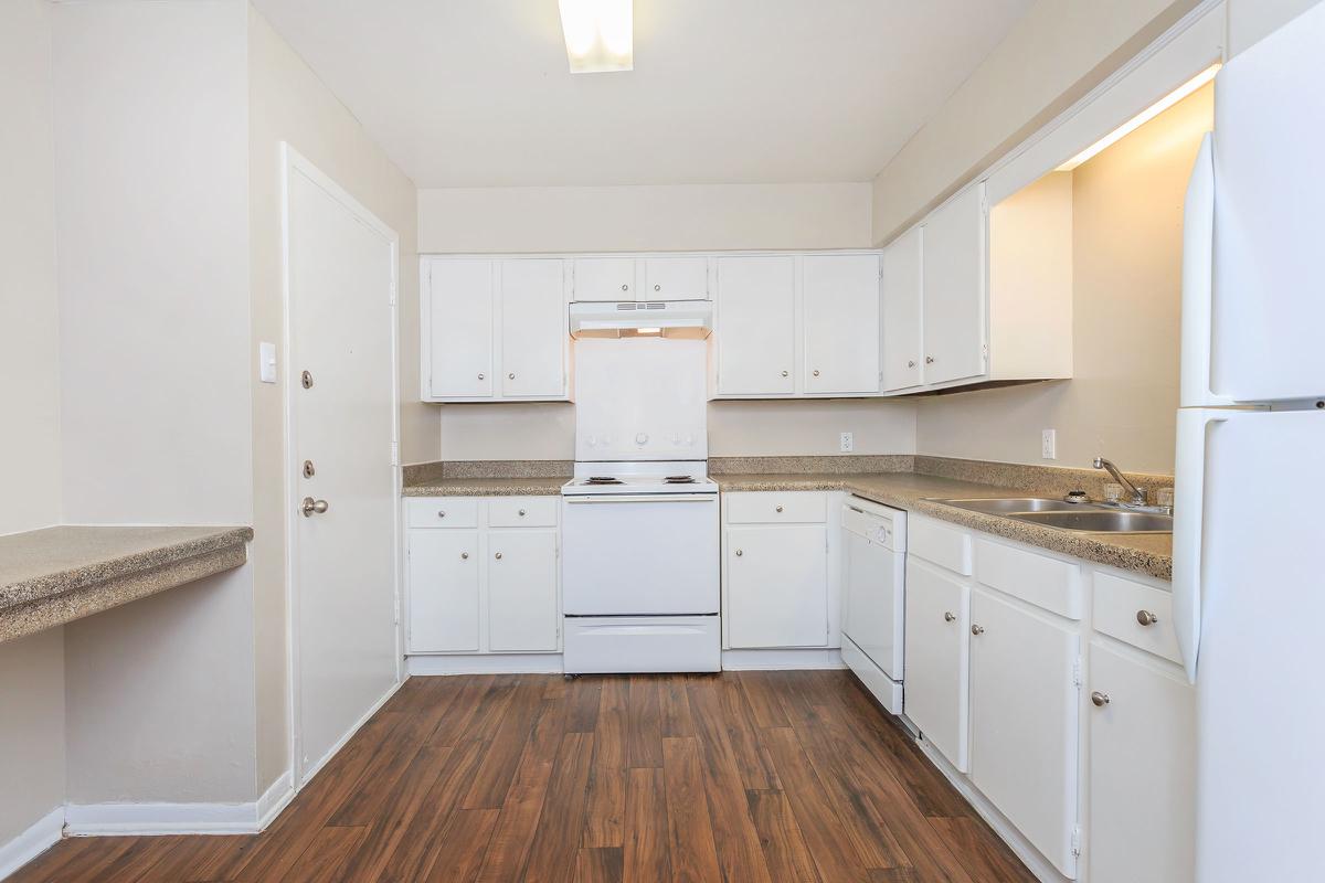 a large white refrigerator in a kitchen