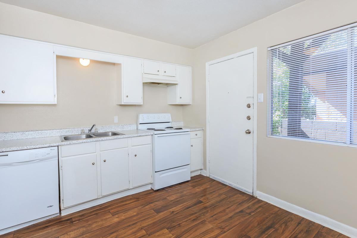 a kitchen with a wood floor