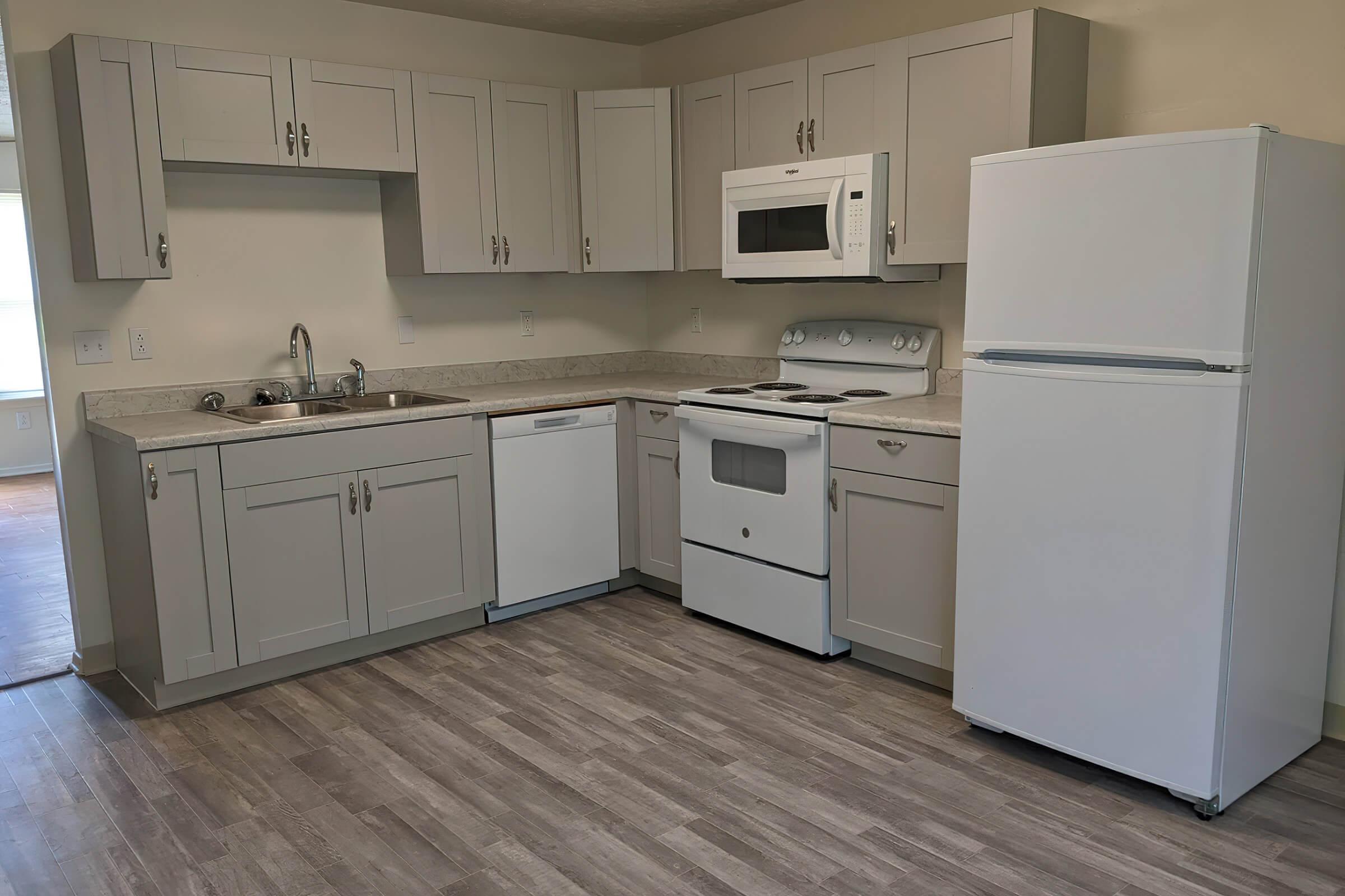 a kitchen with a stove and a refrigerator