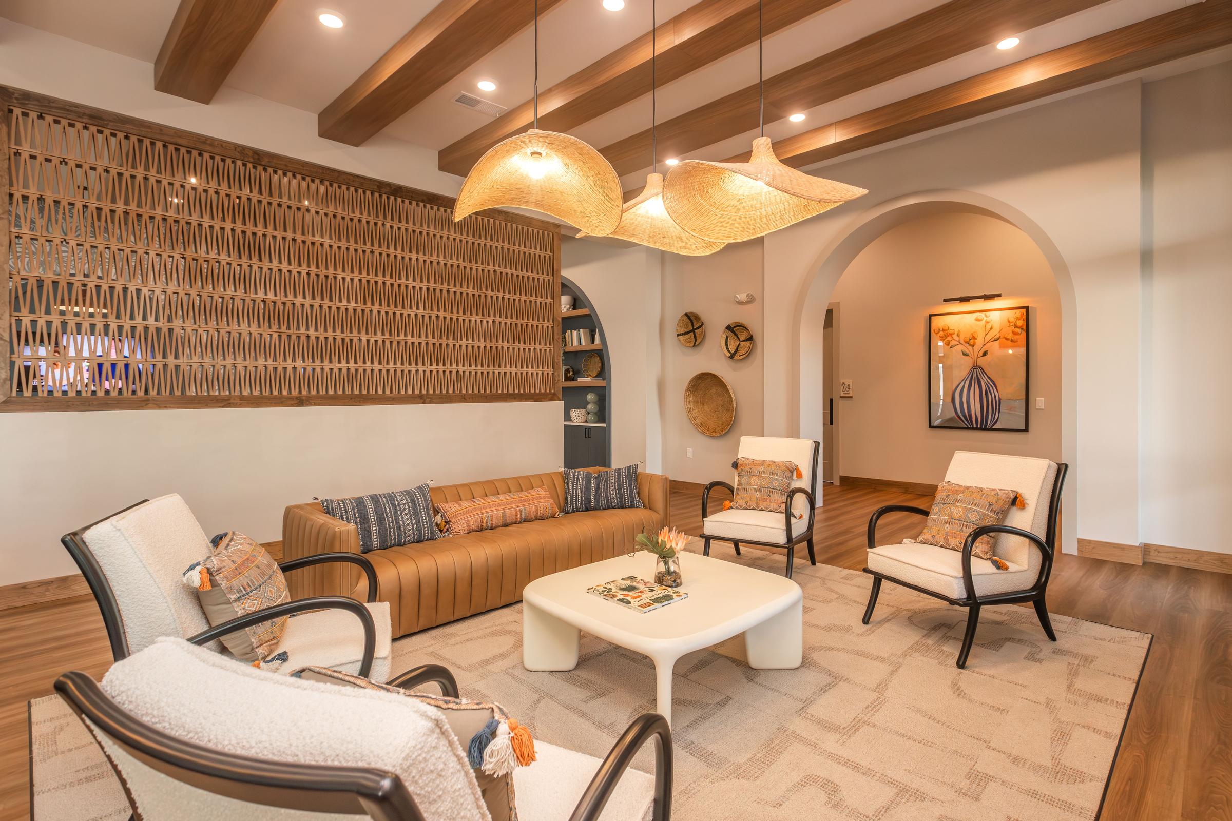 a living room filled with furniture and a fireplace