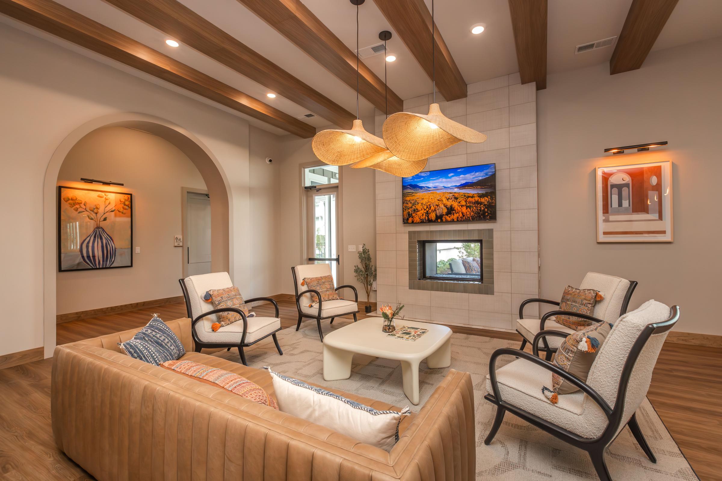 a living room filled with furniture and a fire place