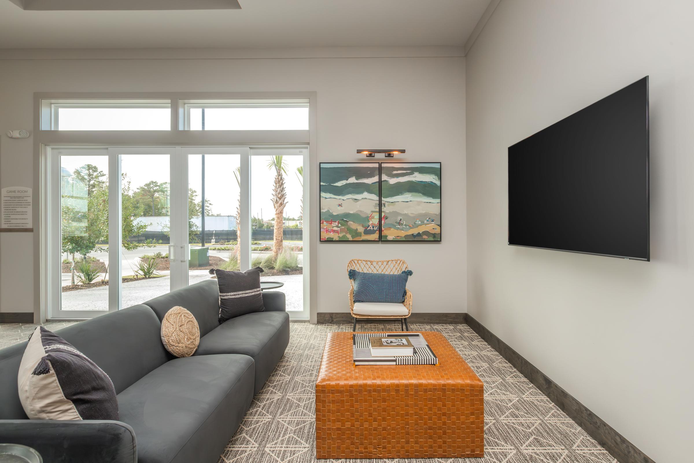 a living room filled with furniture and a large window