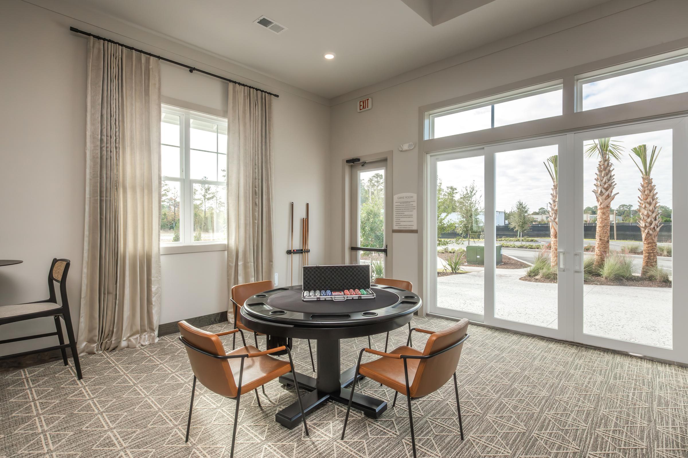 a living room filled with furniture and a large window