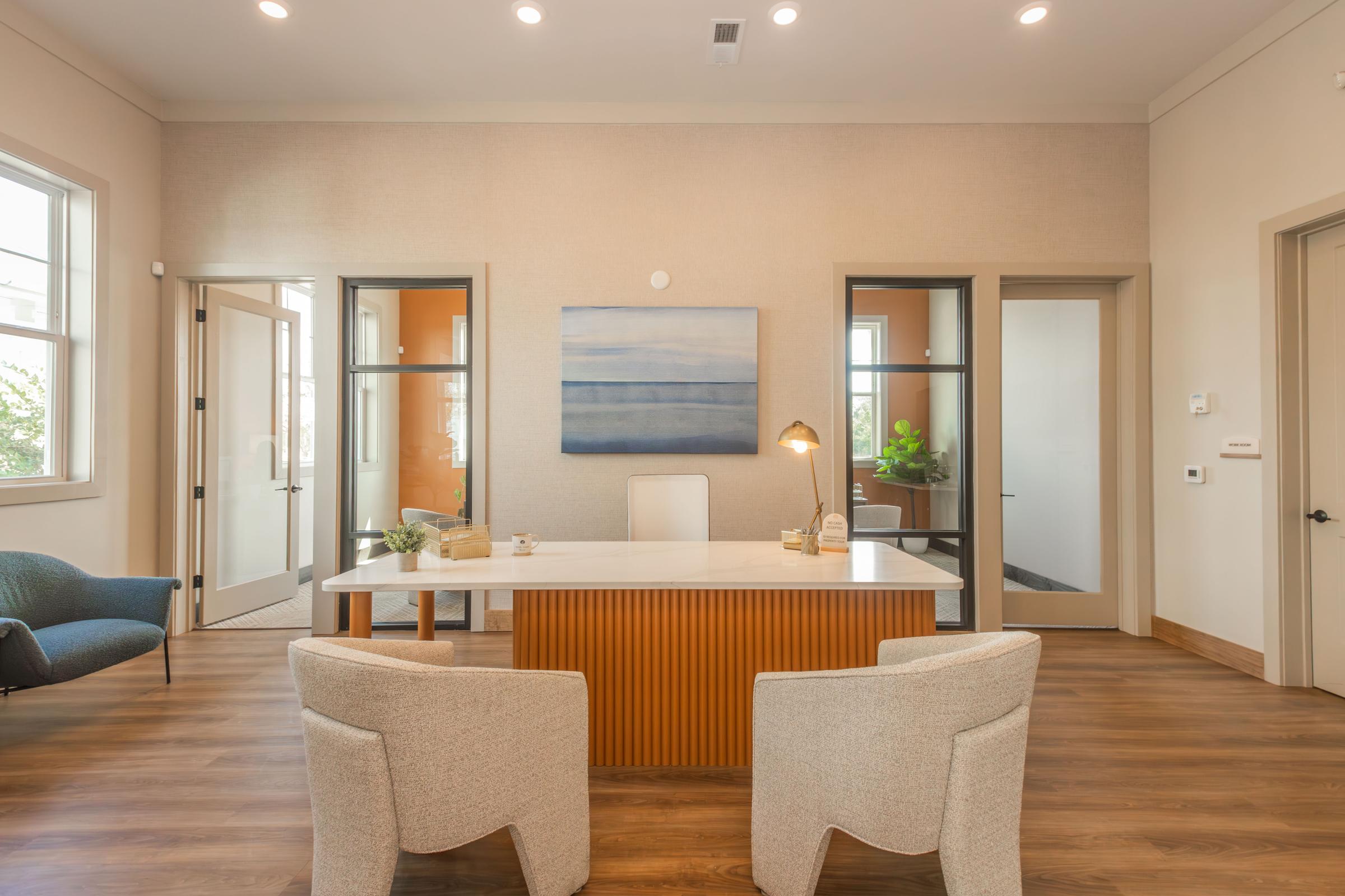 a living room filled with furniture and a large window