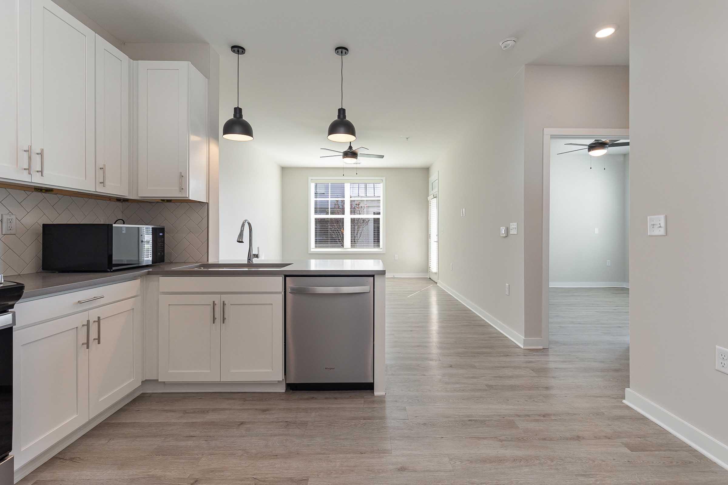 a kitchen with a stove and a refrigerator