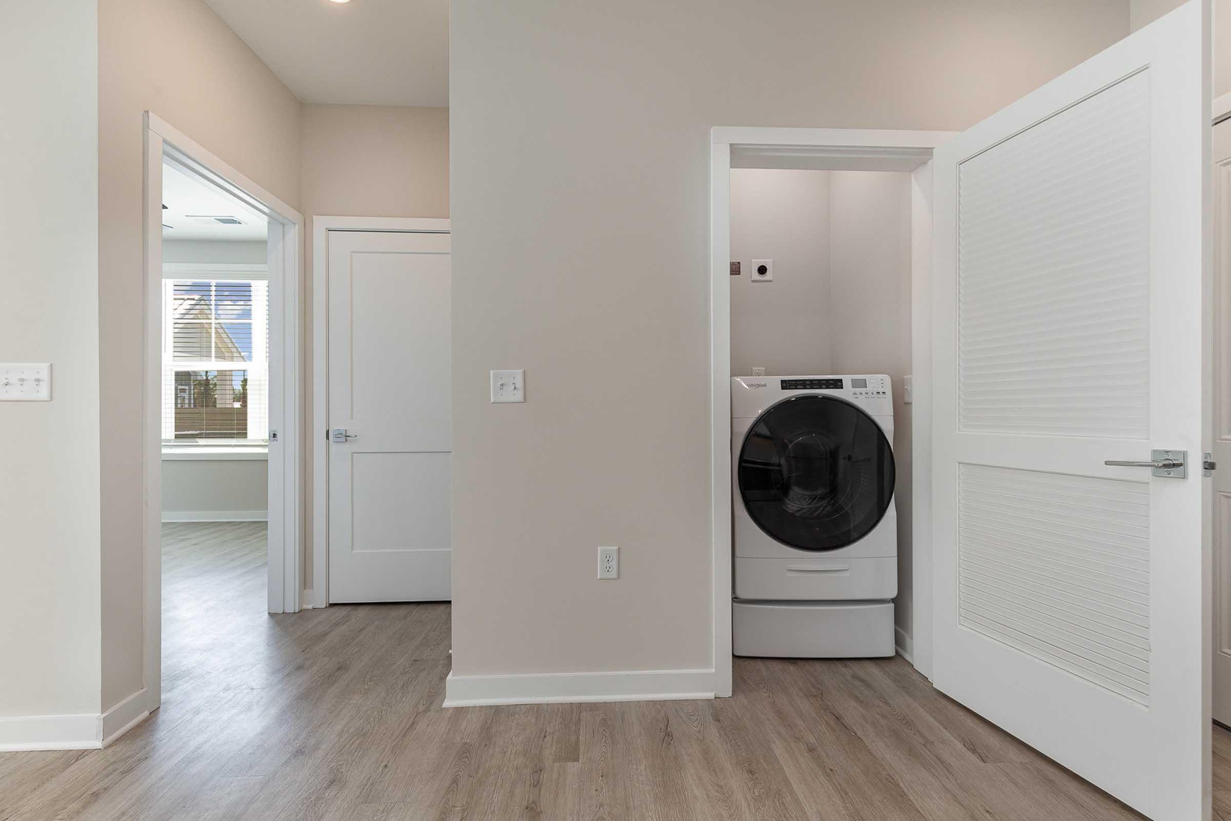 a kitchen with a sink and a mirror