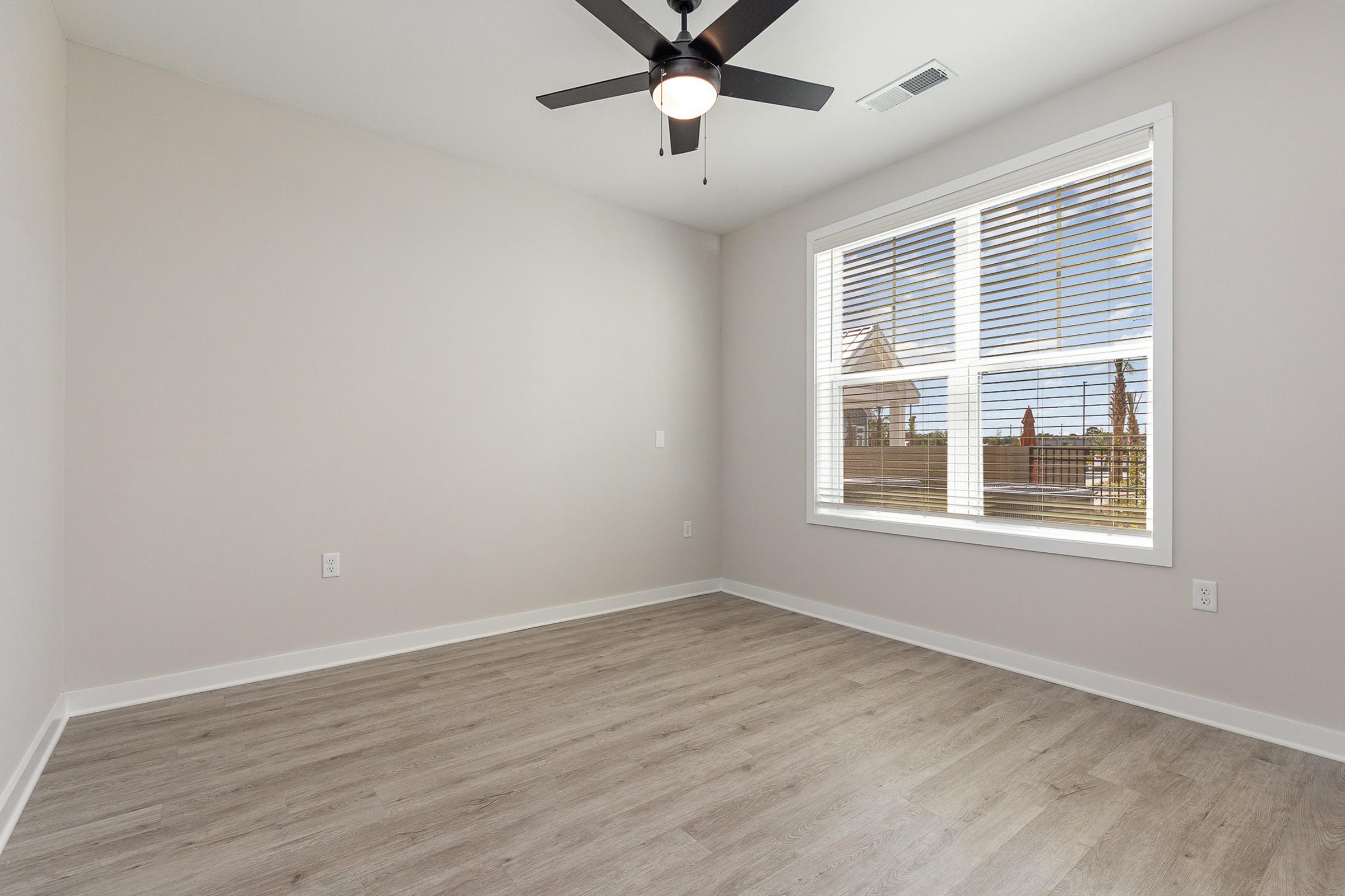 a bedroom with a large window