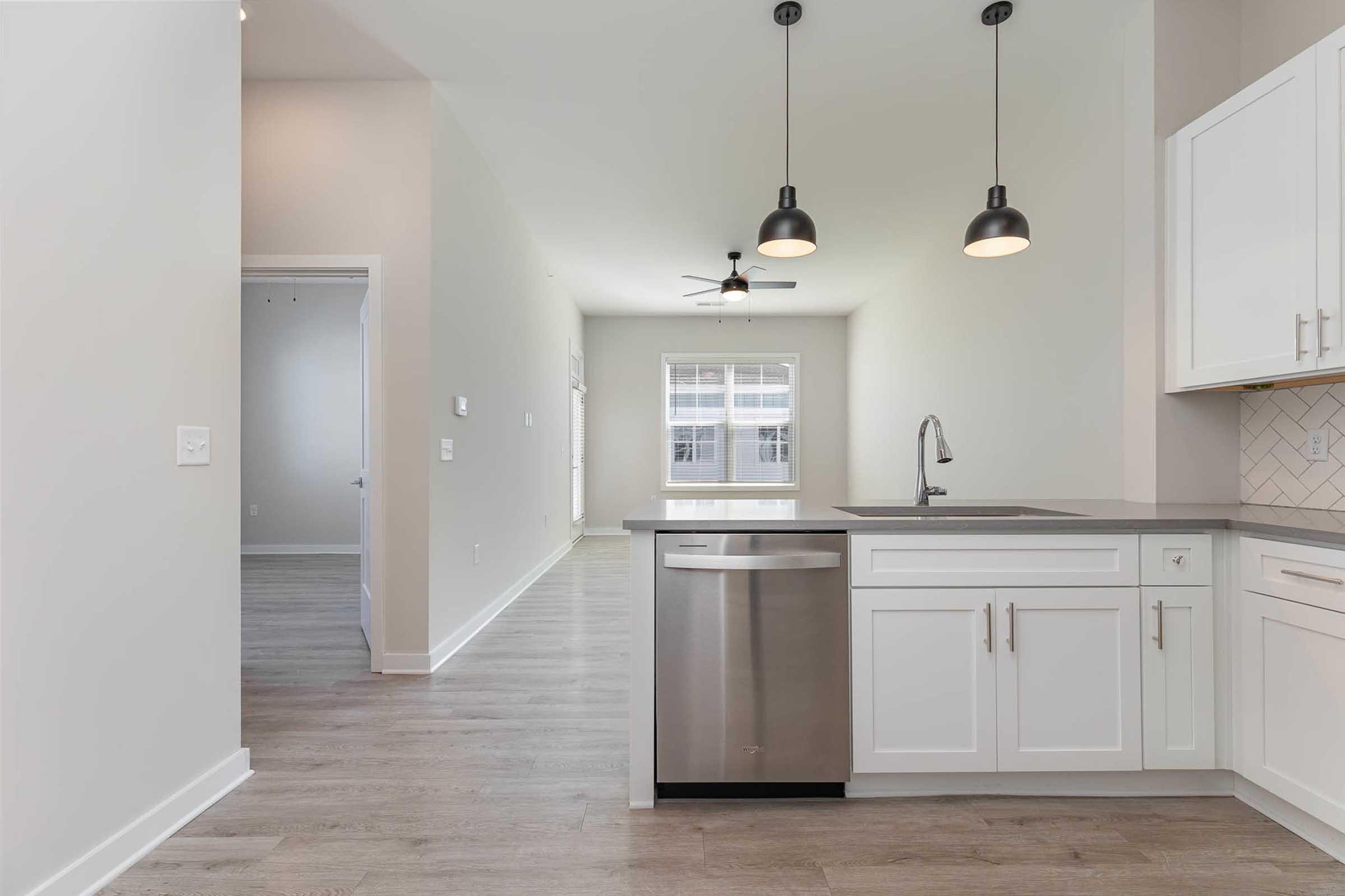 a kitchen with a sink and a refrigerator