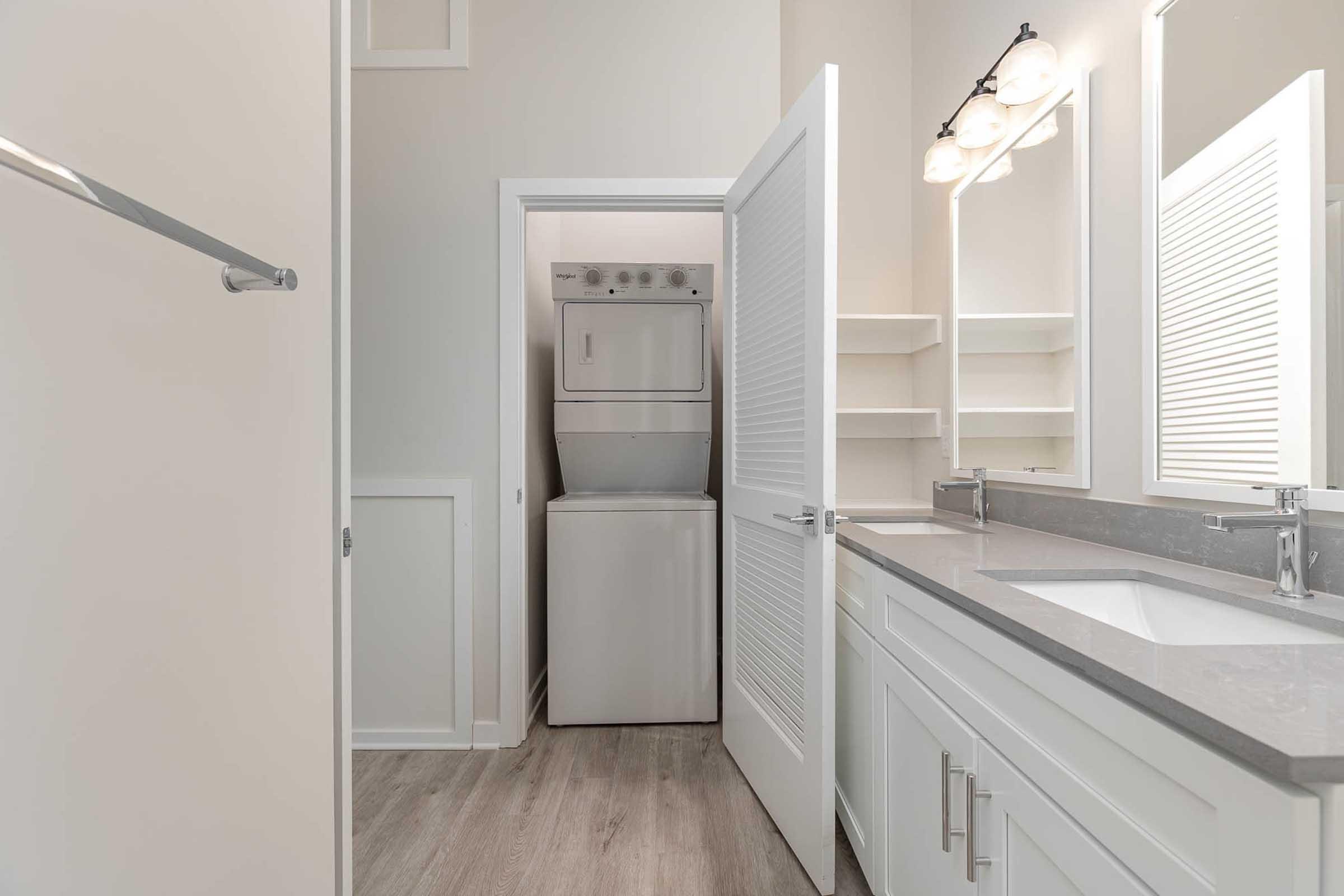 a kitchen with a sink and a mirror