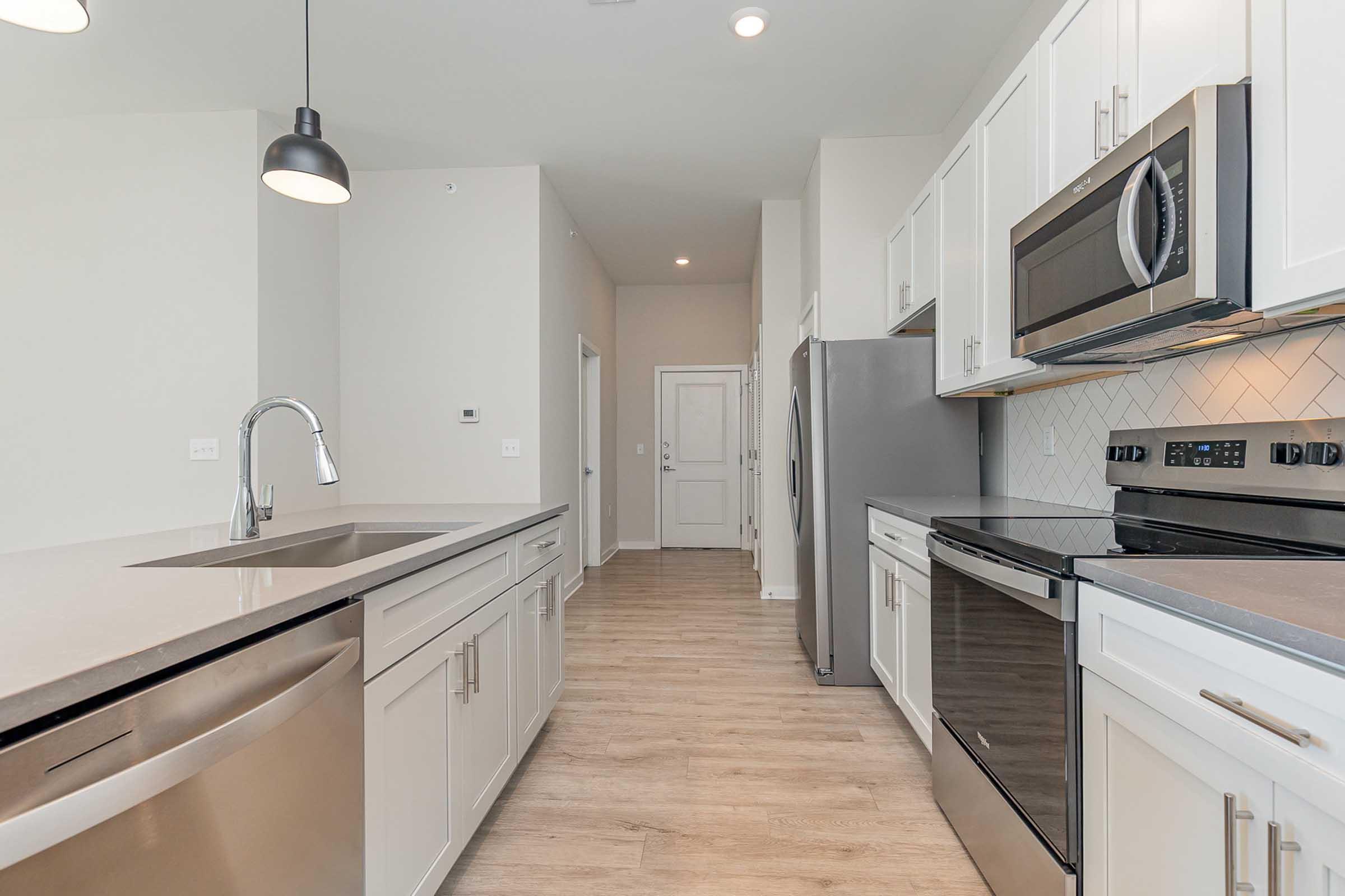 a kitchen with a stove top oven