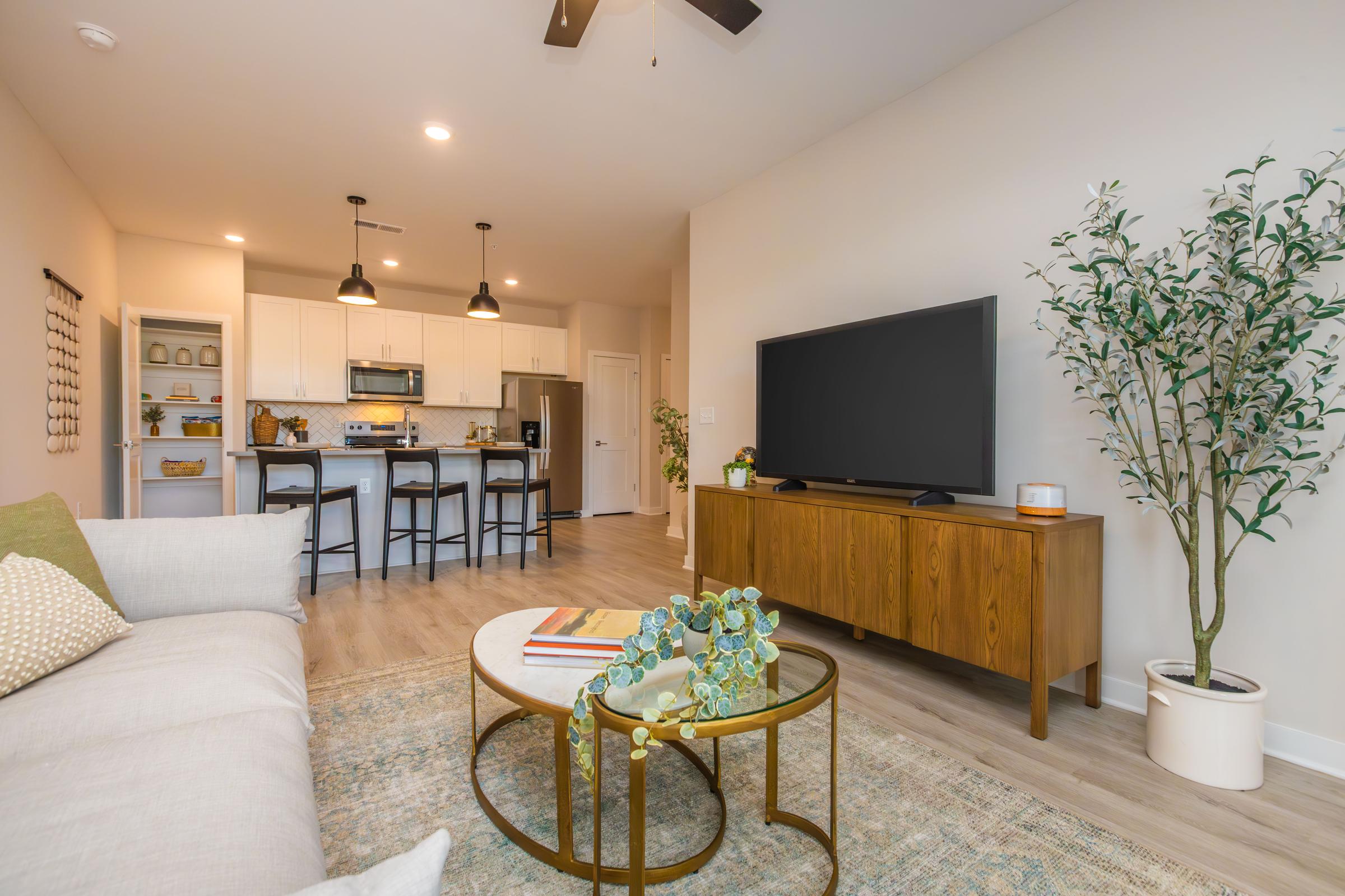 a living room filled with furniture and a fireplace