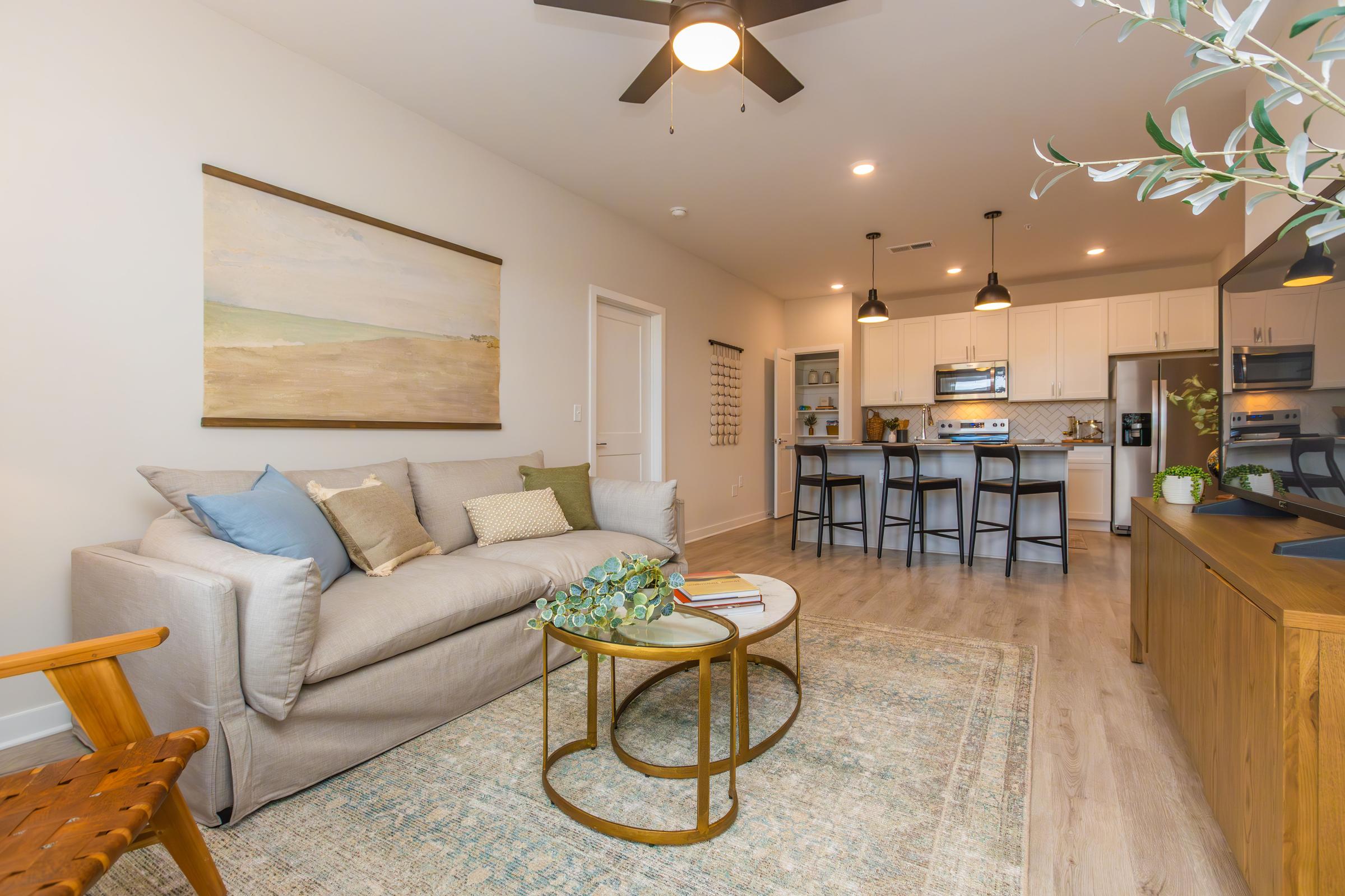 a living room filled with furniture and a fireplace