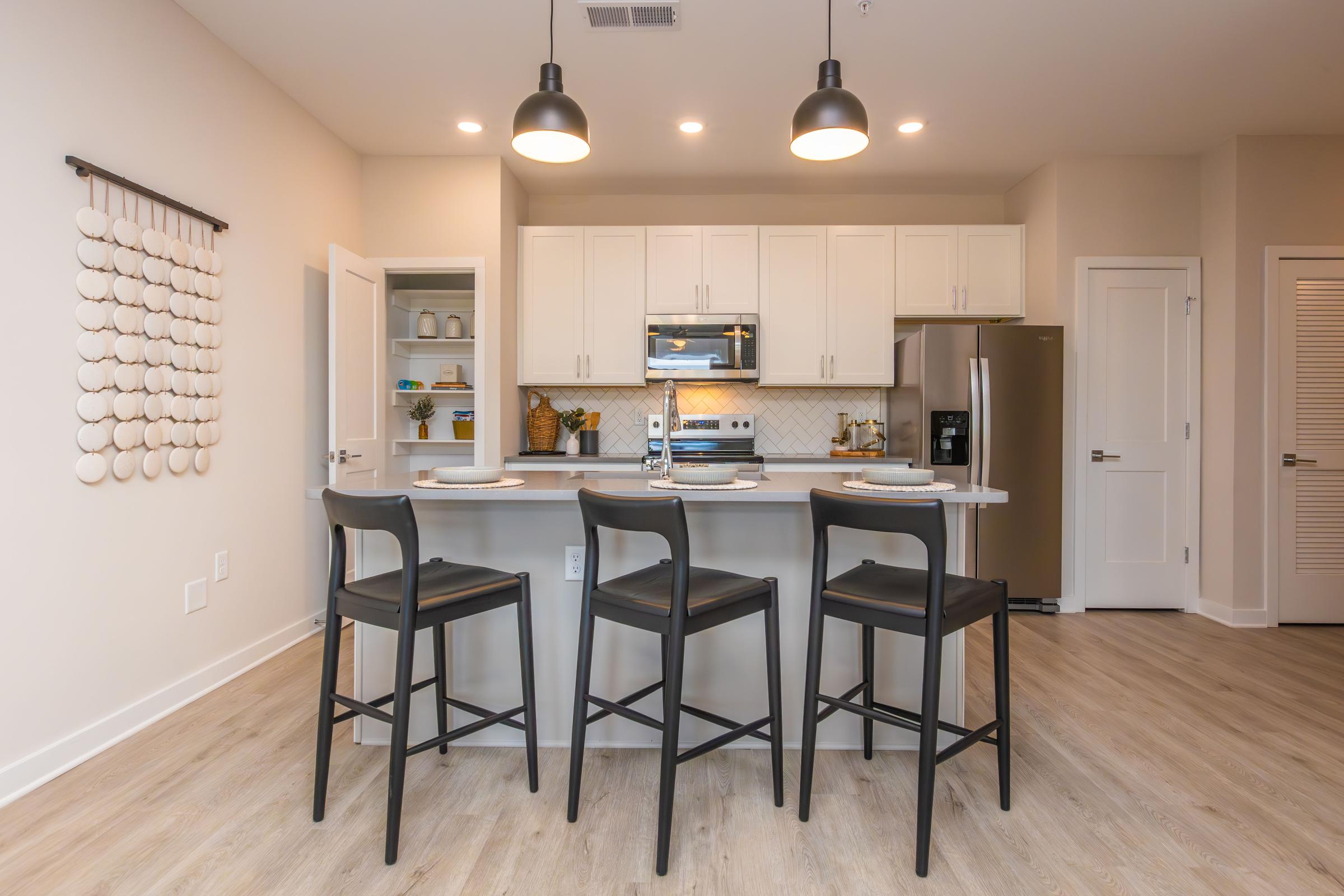 a kitchen with a dining room table