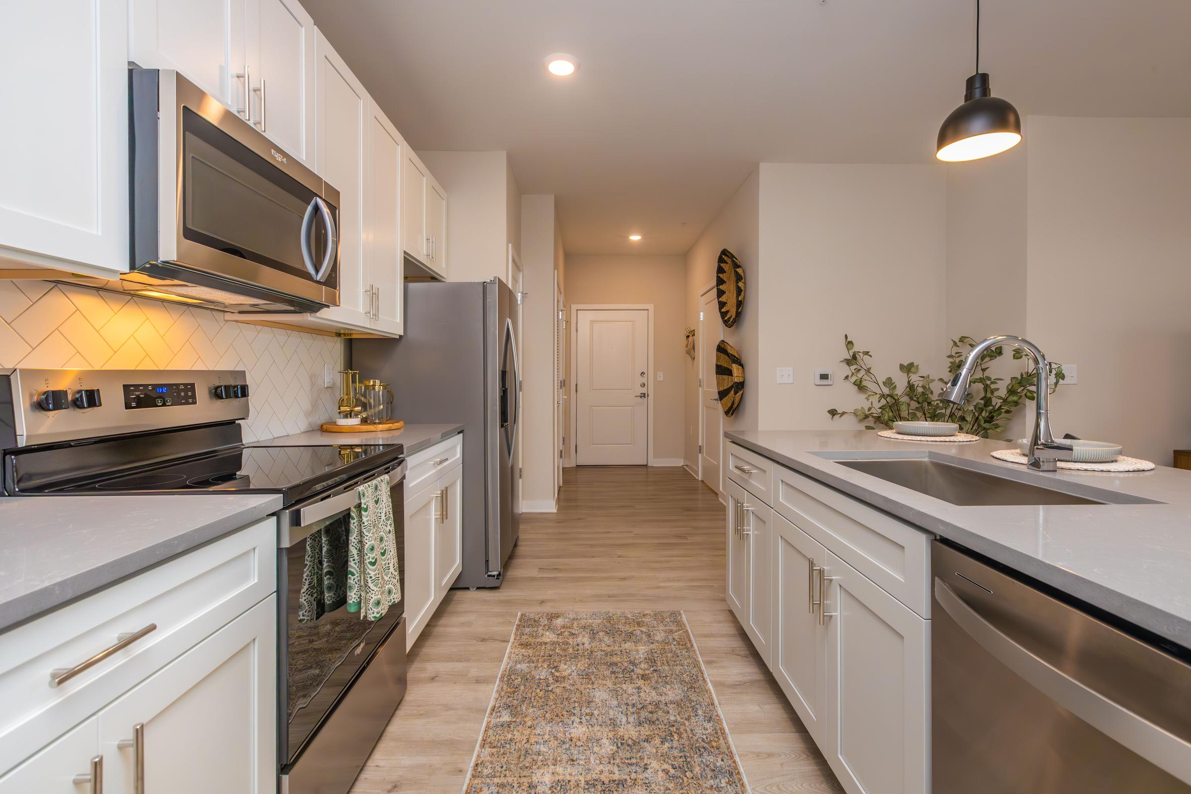 a kitchen with a stove top oven