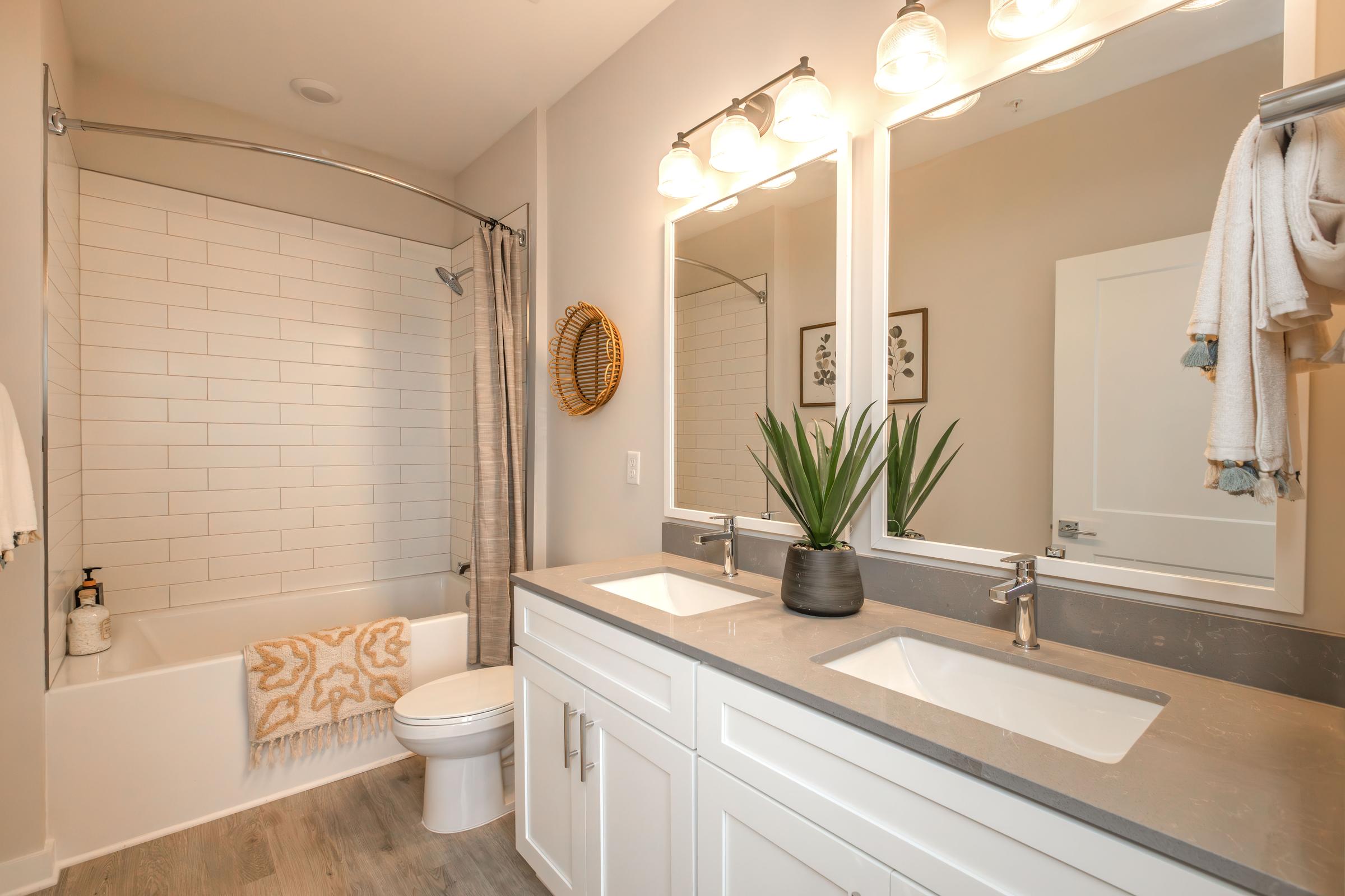 a kitchen with a sink and a mirror