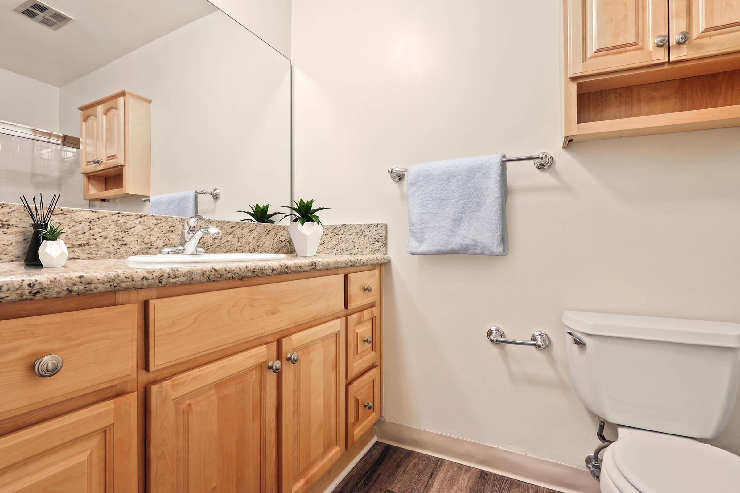 a kitchen with a sink and a mirror