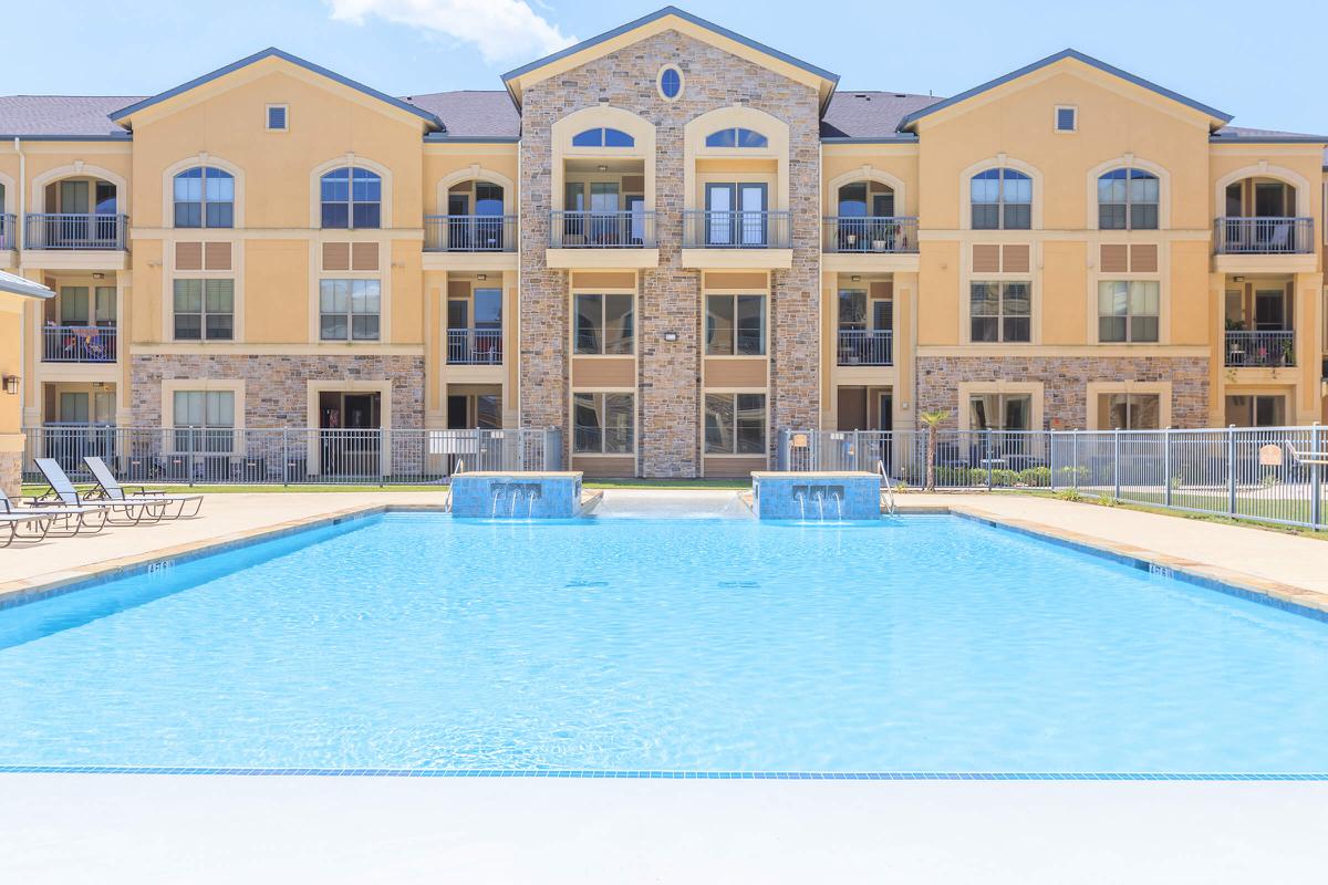 a large pool of water in front of a building