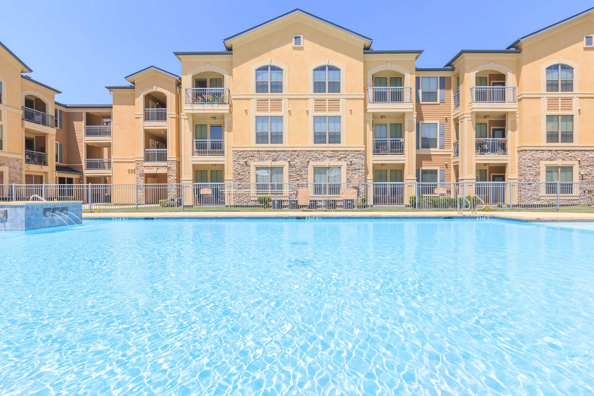 a large pool of water in front of a building