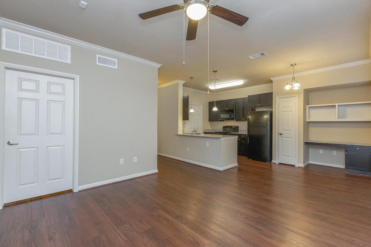 a large empty room with a wood floor