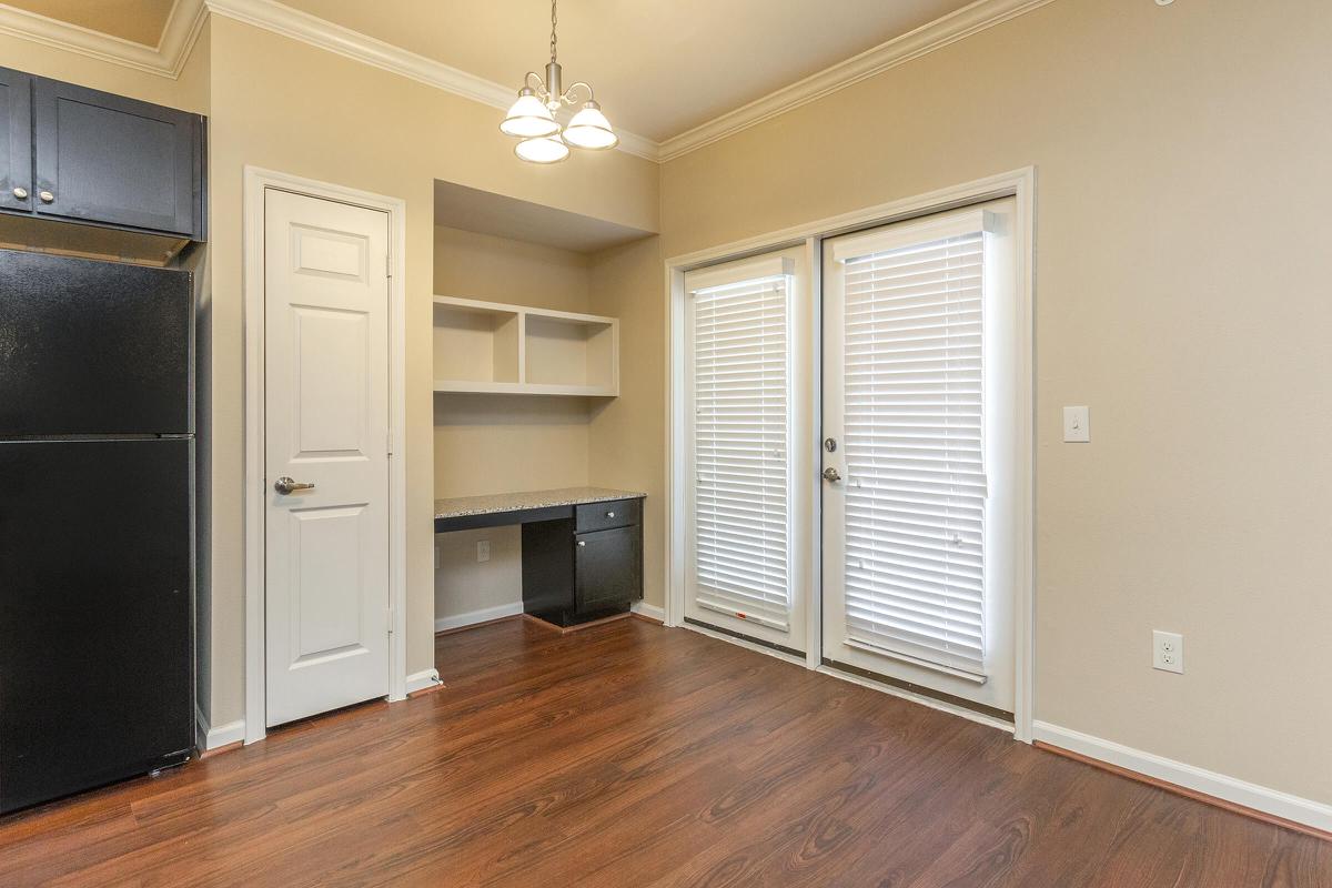 a kitchen with a wood floor