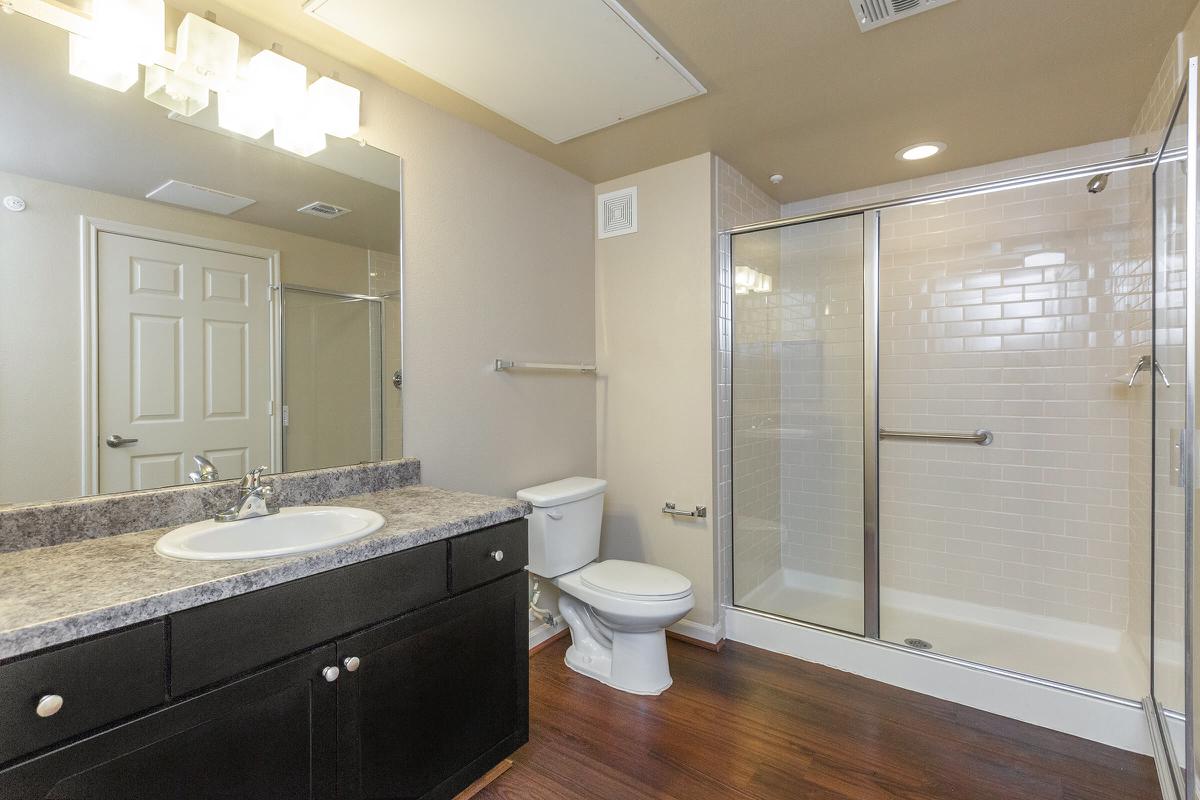 a large white tub next to a sink