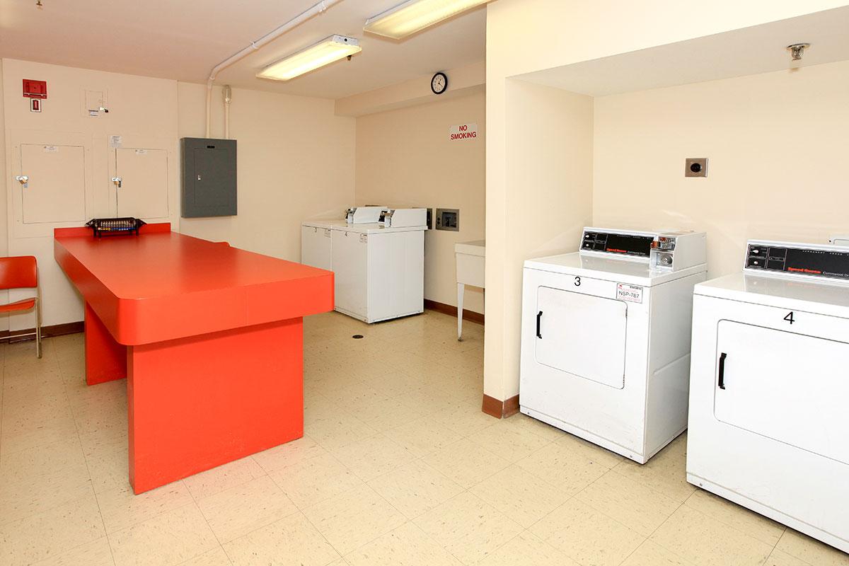 a white refrigerator freezer sitting inside of a kitchen