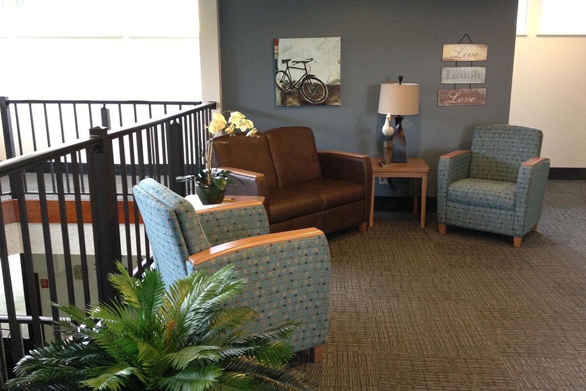 a living room filled with furniture and a table