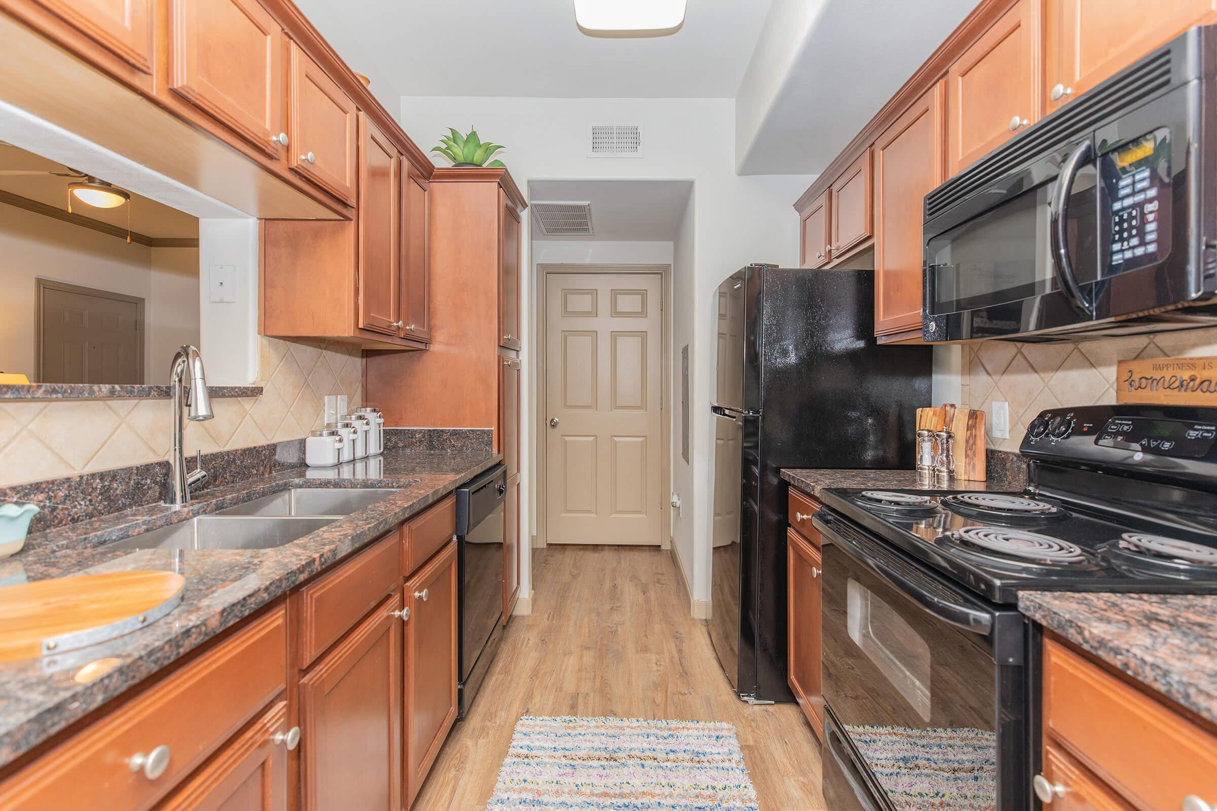 a large kitchen with stainless steel appliances