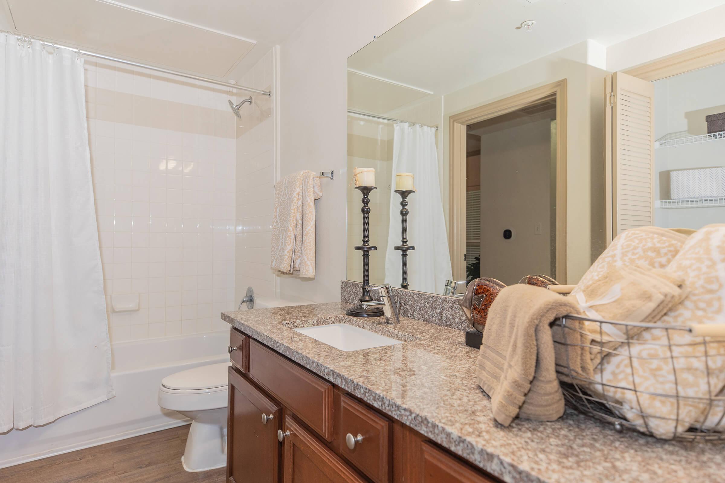 a bedroom with a large mirror