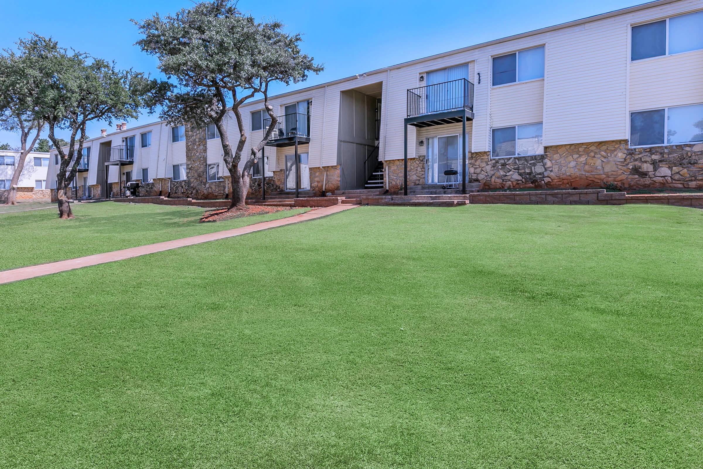 a large lawn in front of a building