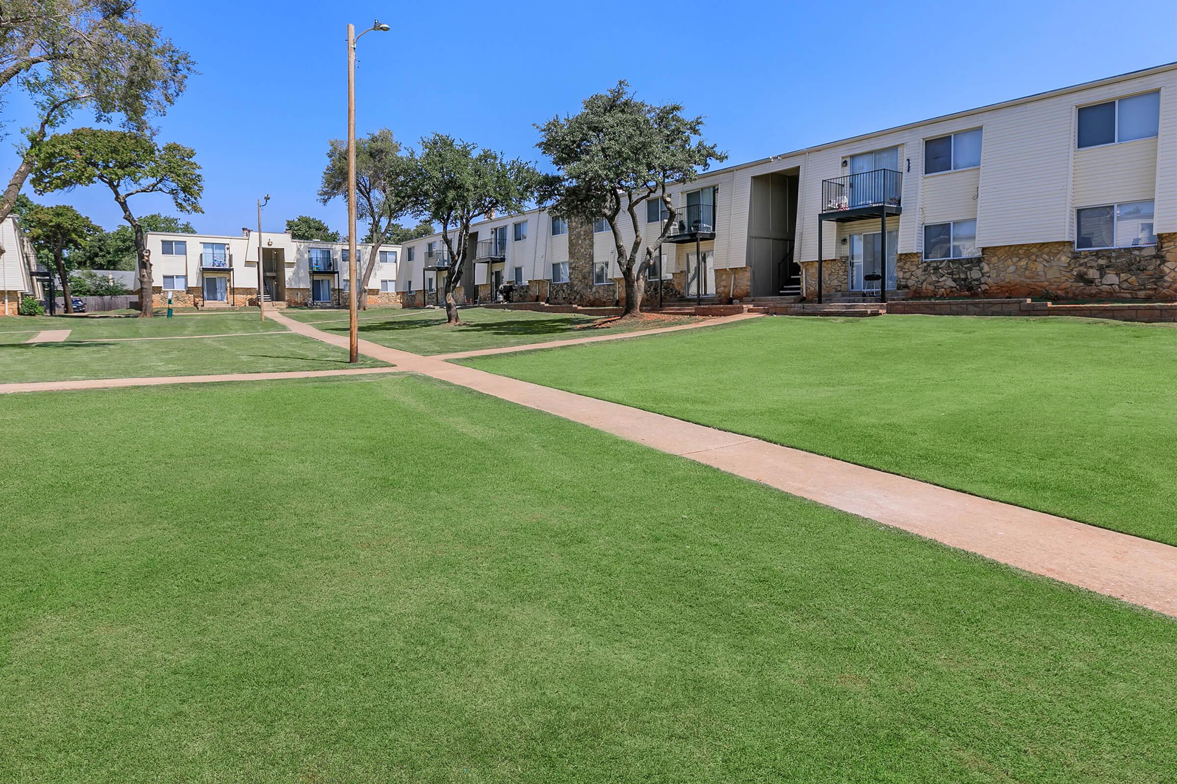 a large lawn in front of a house