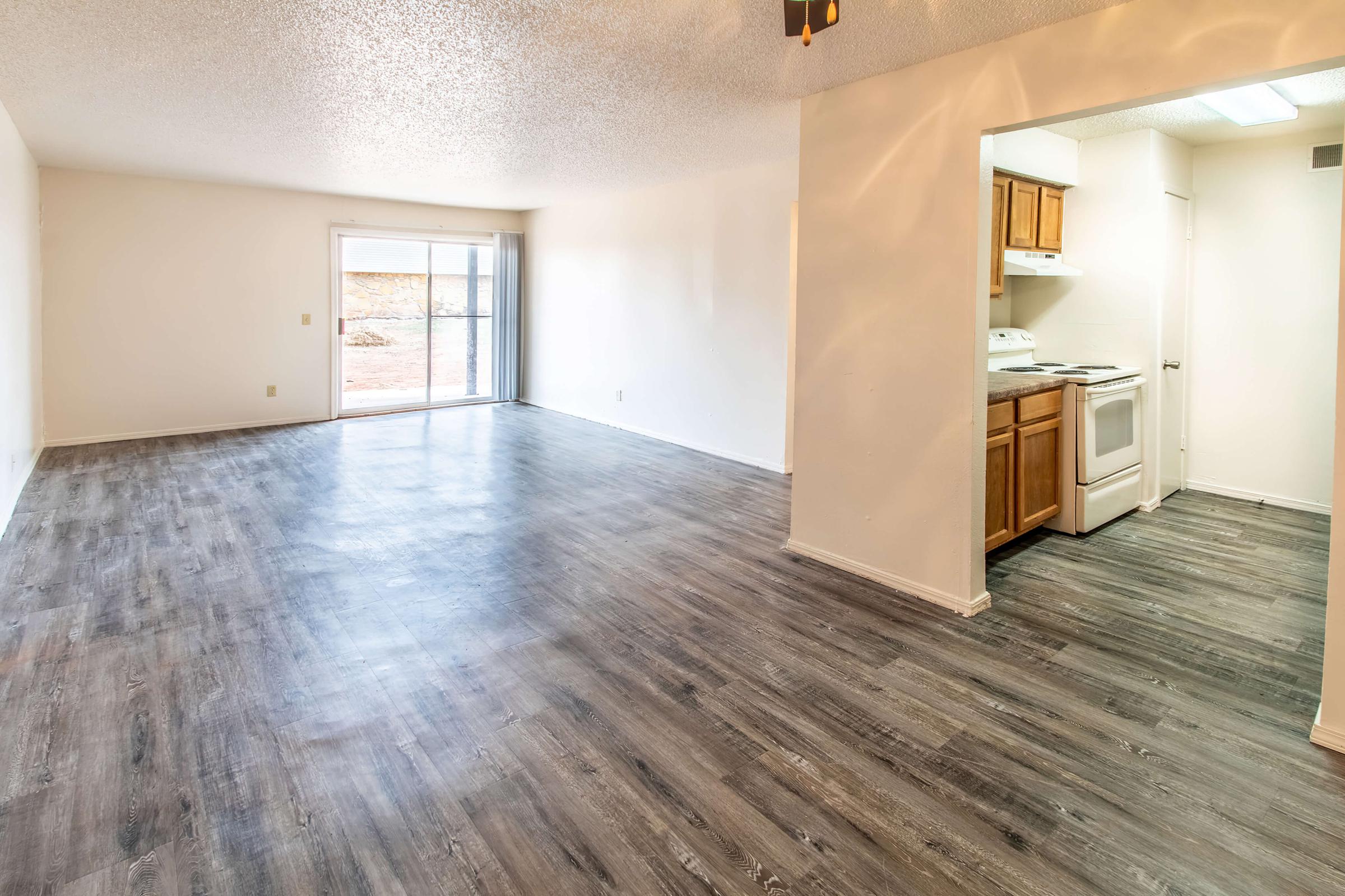 a large empty room with a wooden floor