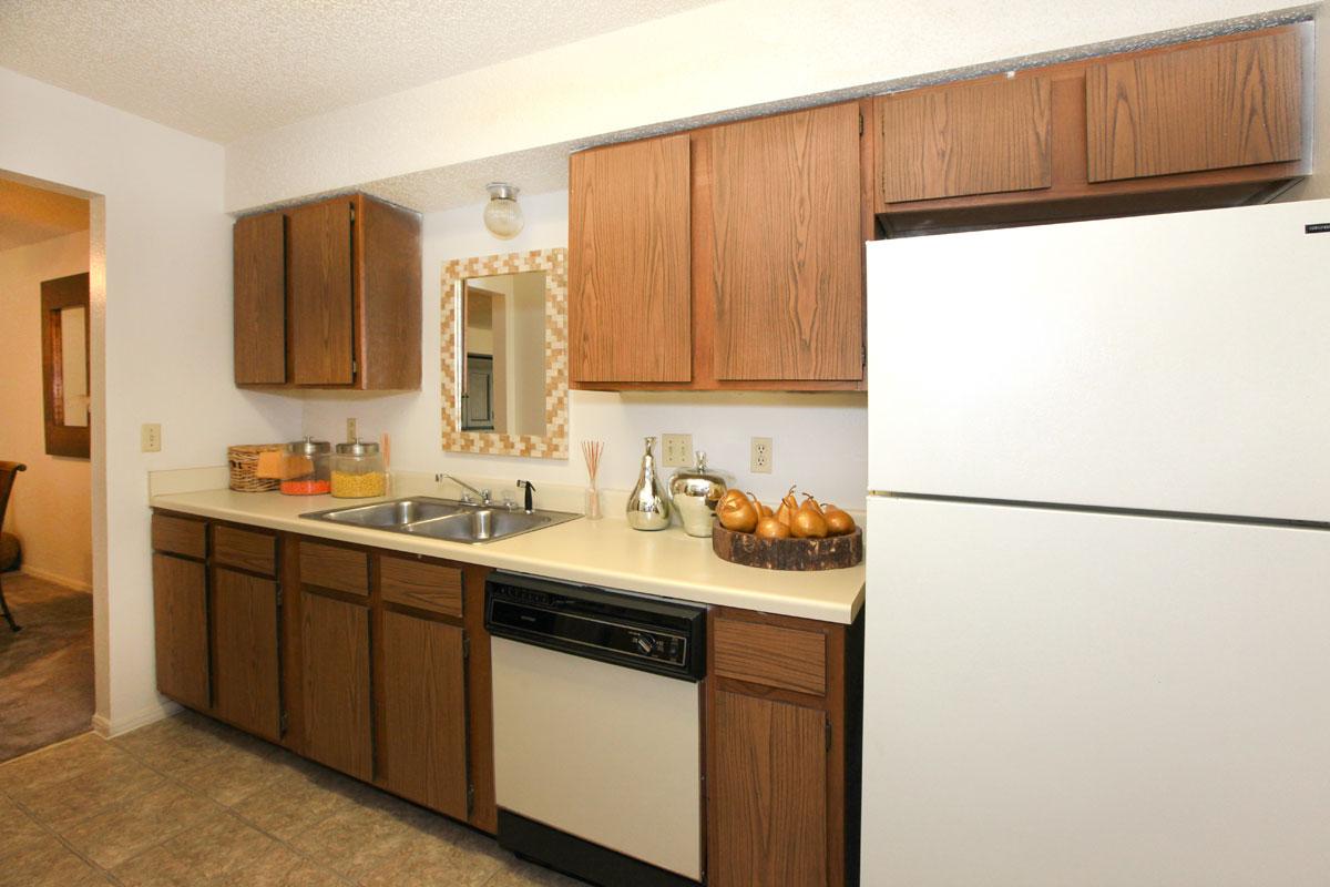 a white refrigerator freezer sitting inside of a kitchen