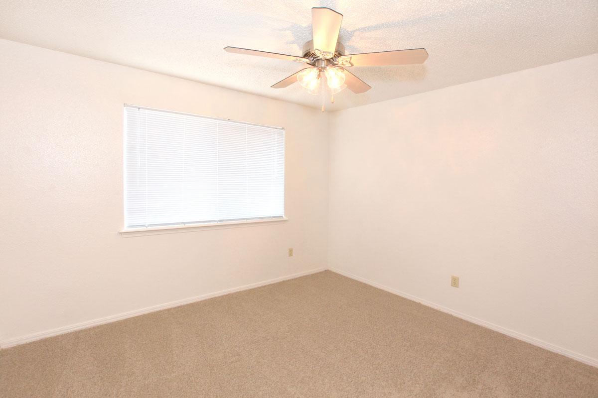 a bedroom with a large mirror