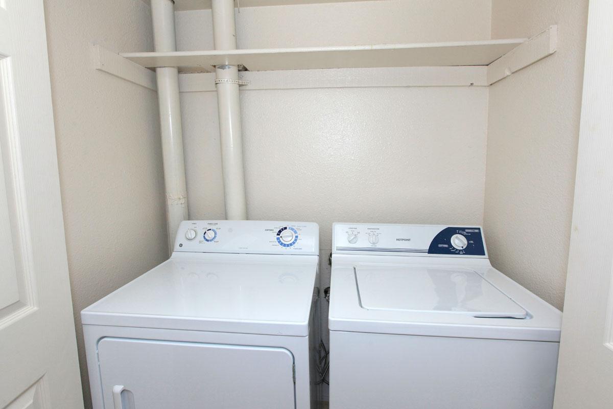 a white refrigerator freezer sitting next to a sink