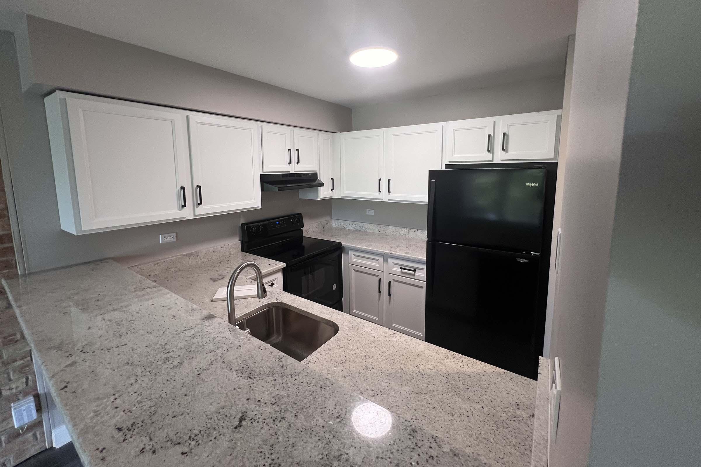 a stainless steel refrigerator in a kitchen